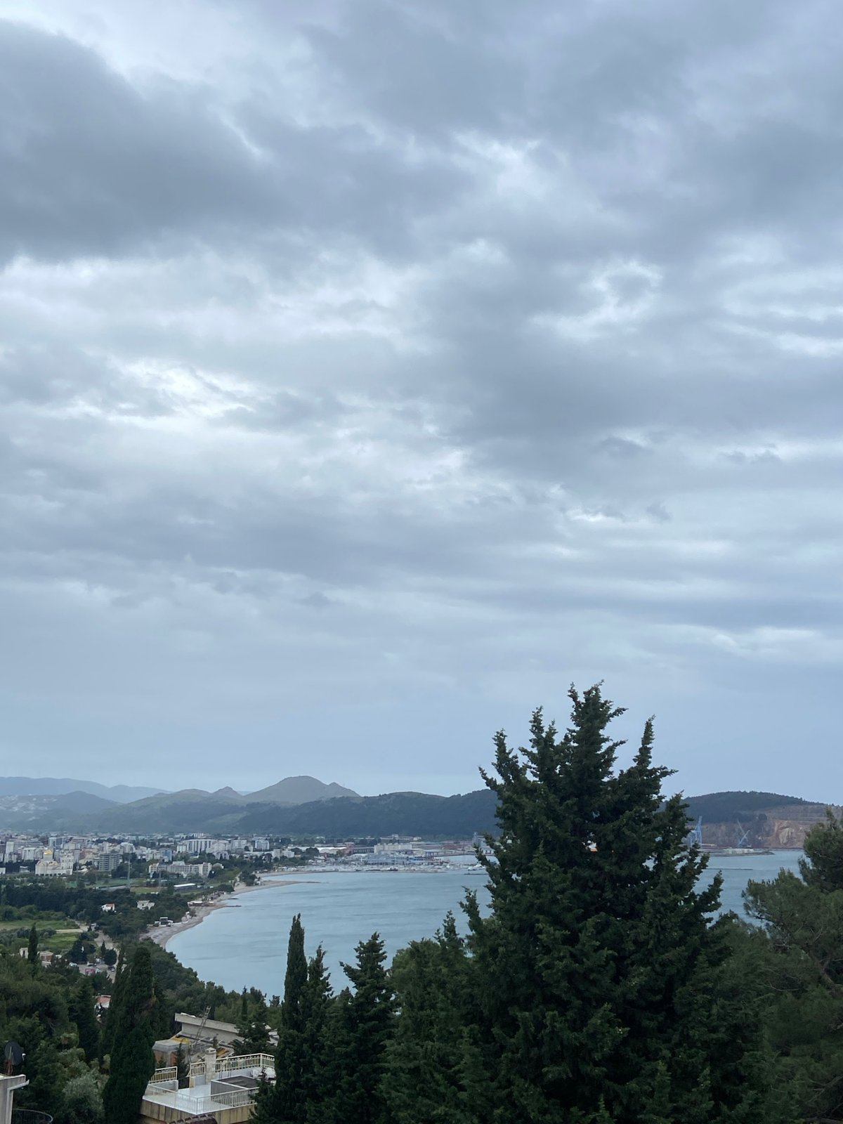 Elevated view captured of Šušanj coastline under cloudy skies
