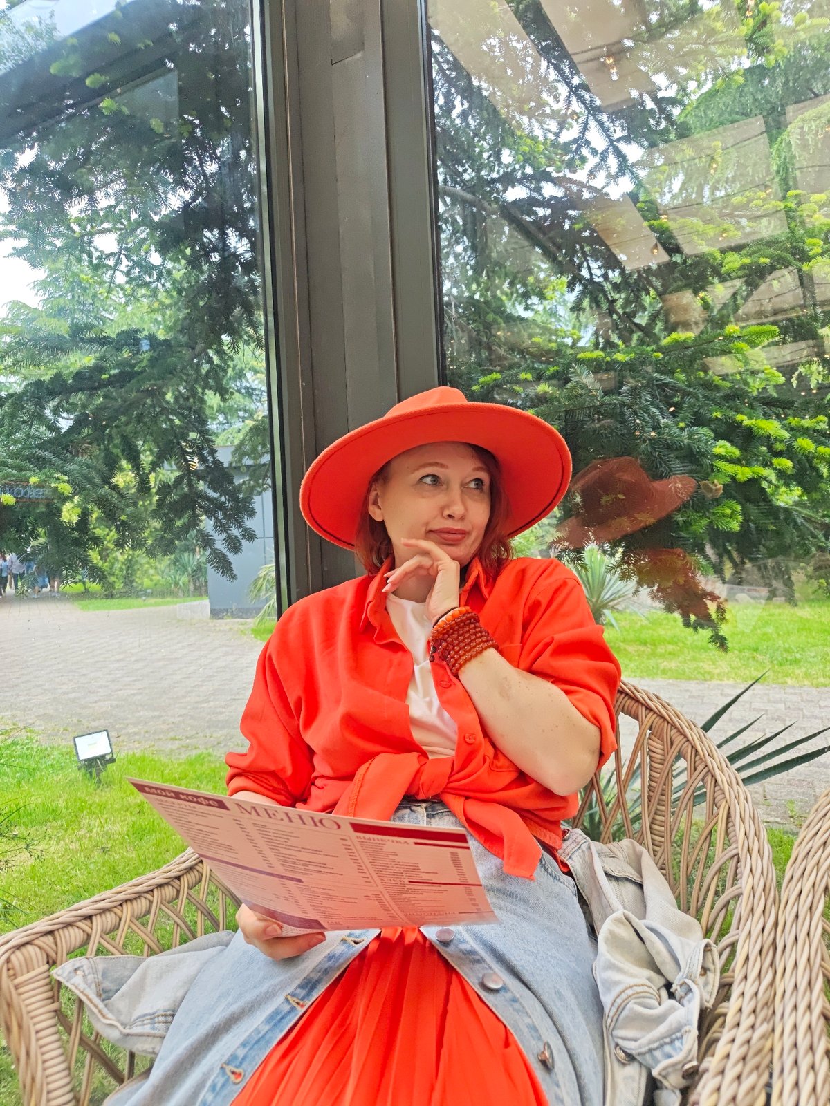 Woman in orange outfit spotted across multiple Sochi locations