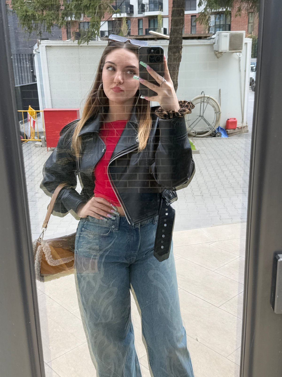 Two women captured in mirror reflection in Sofia