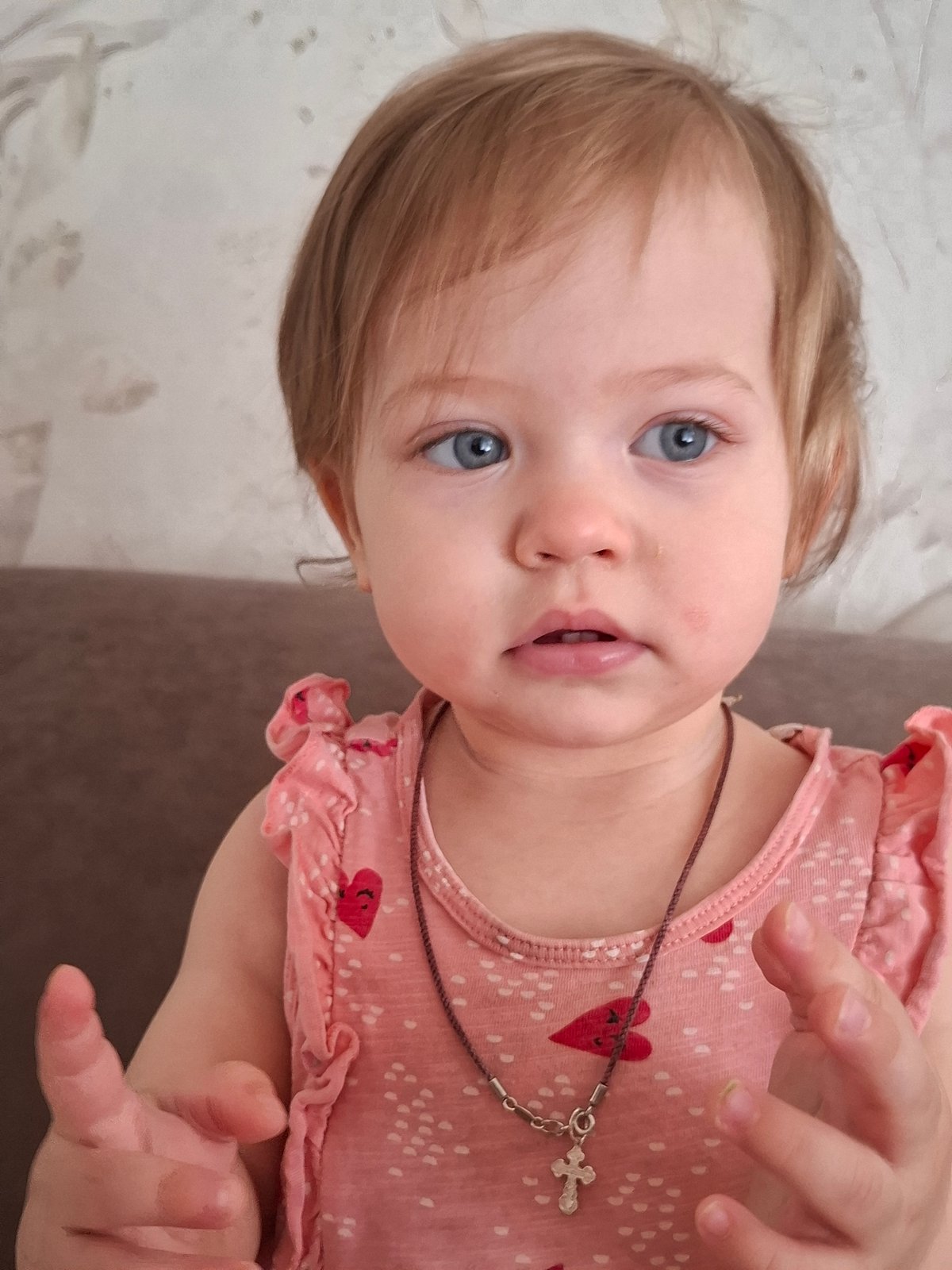 Toddler and cat captured in domestic portraits in Chaikovsky