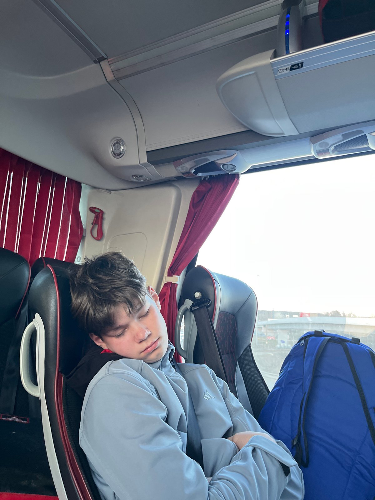 Young passenger sleeps on bus in Odintsovo, Russia