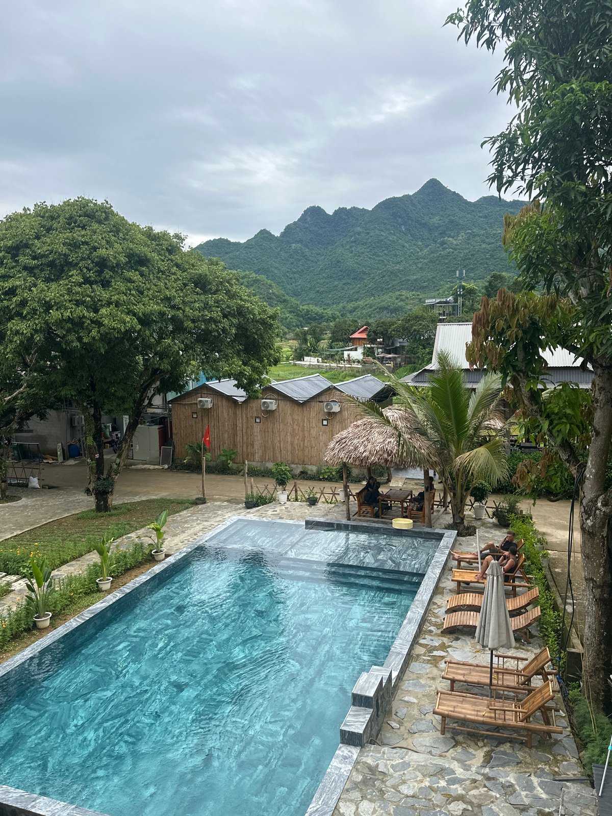 Resort pool area documented in Mai Chau Vietnam morning