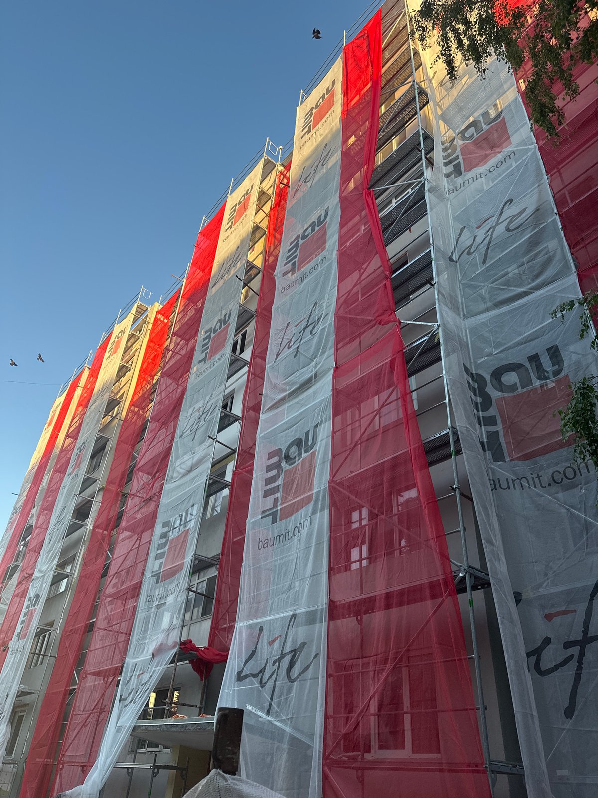 Urban afternoon: rides, streets, and scaffolding in an Eastern European city