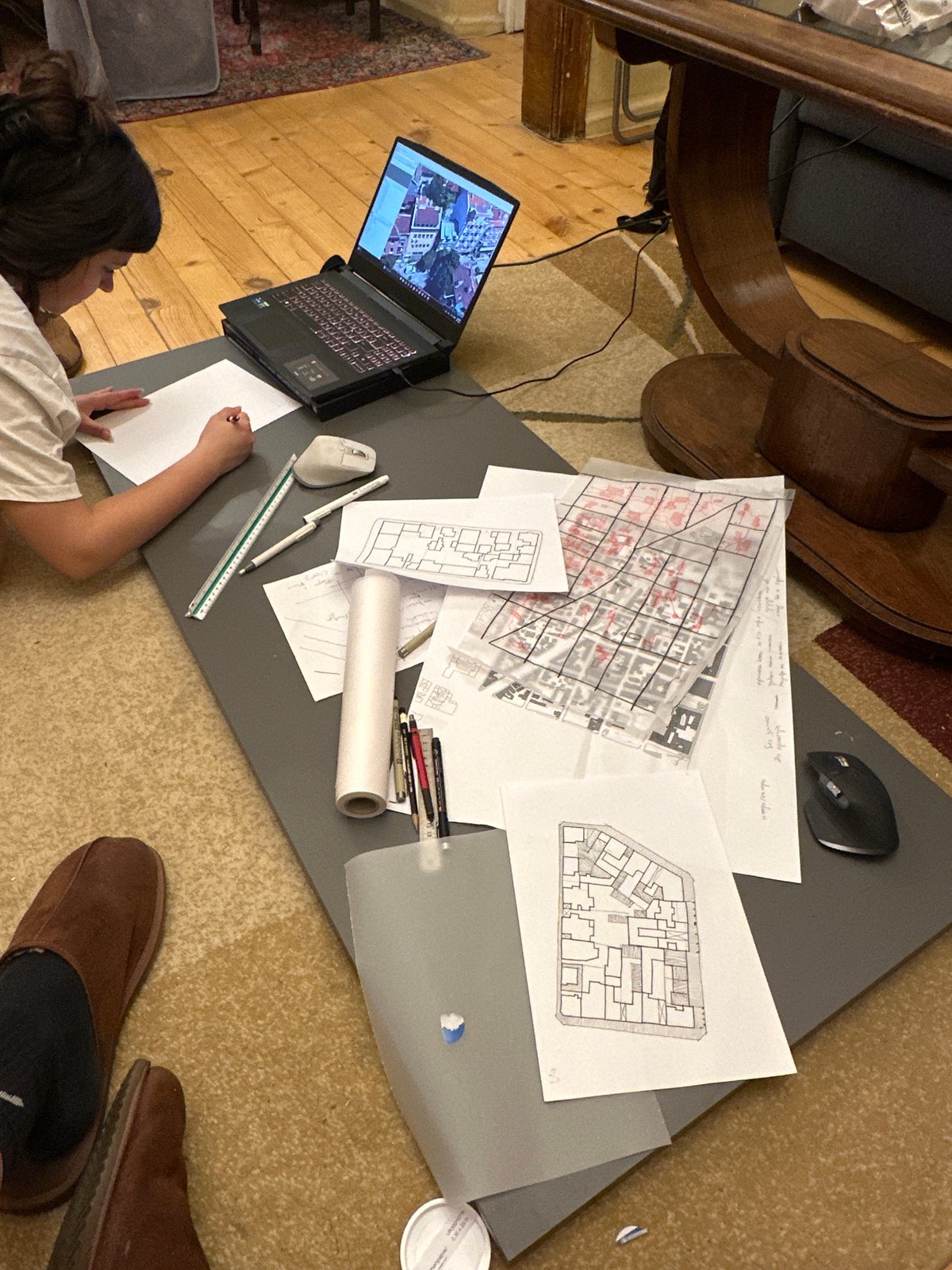 Person works on architectural plans at Sofia home