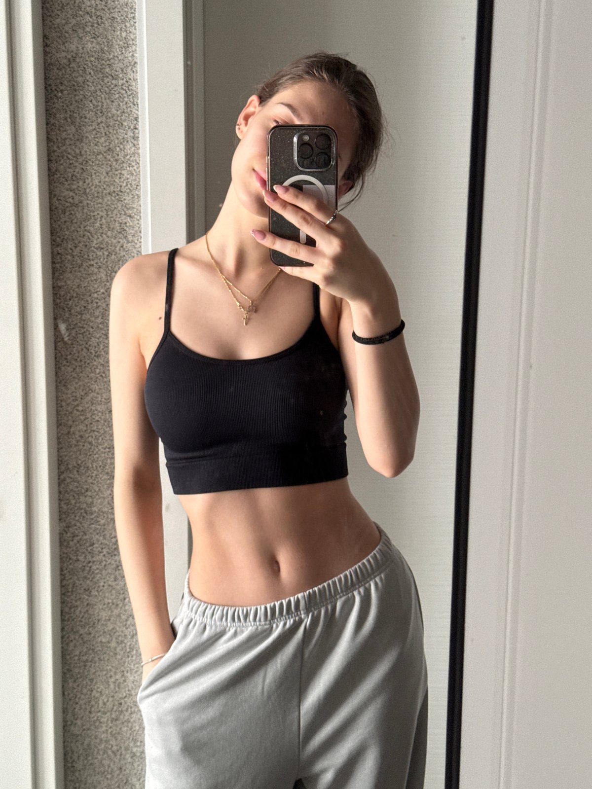 Woman takes morning mirror selfies in Sofia apartment
