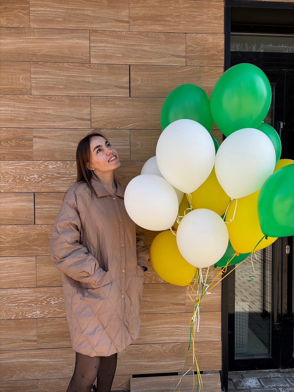 Woman photographed with colorful balloons on floor in Izhevsk