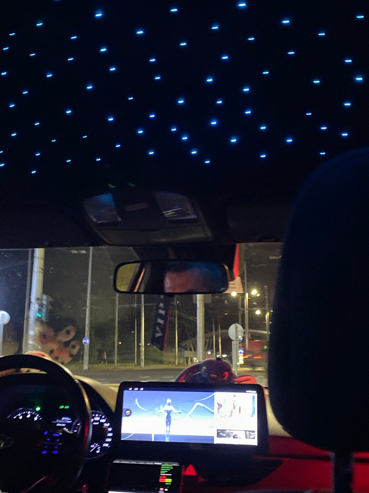 Car interior with blue ceiling lights, nighttime Burgas