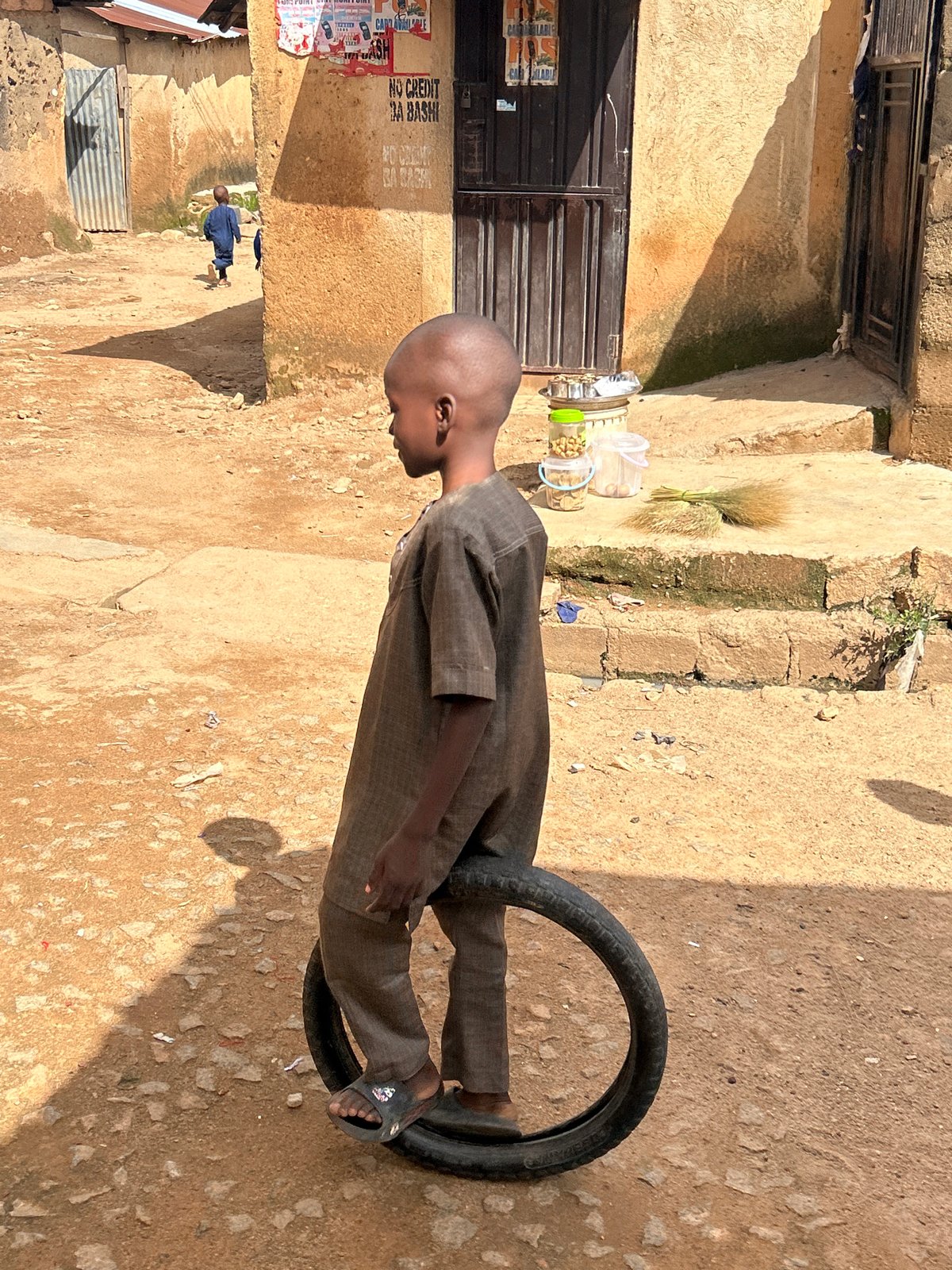Midday street life across Jos, Nigeria's busy market district