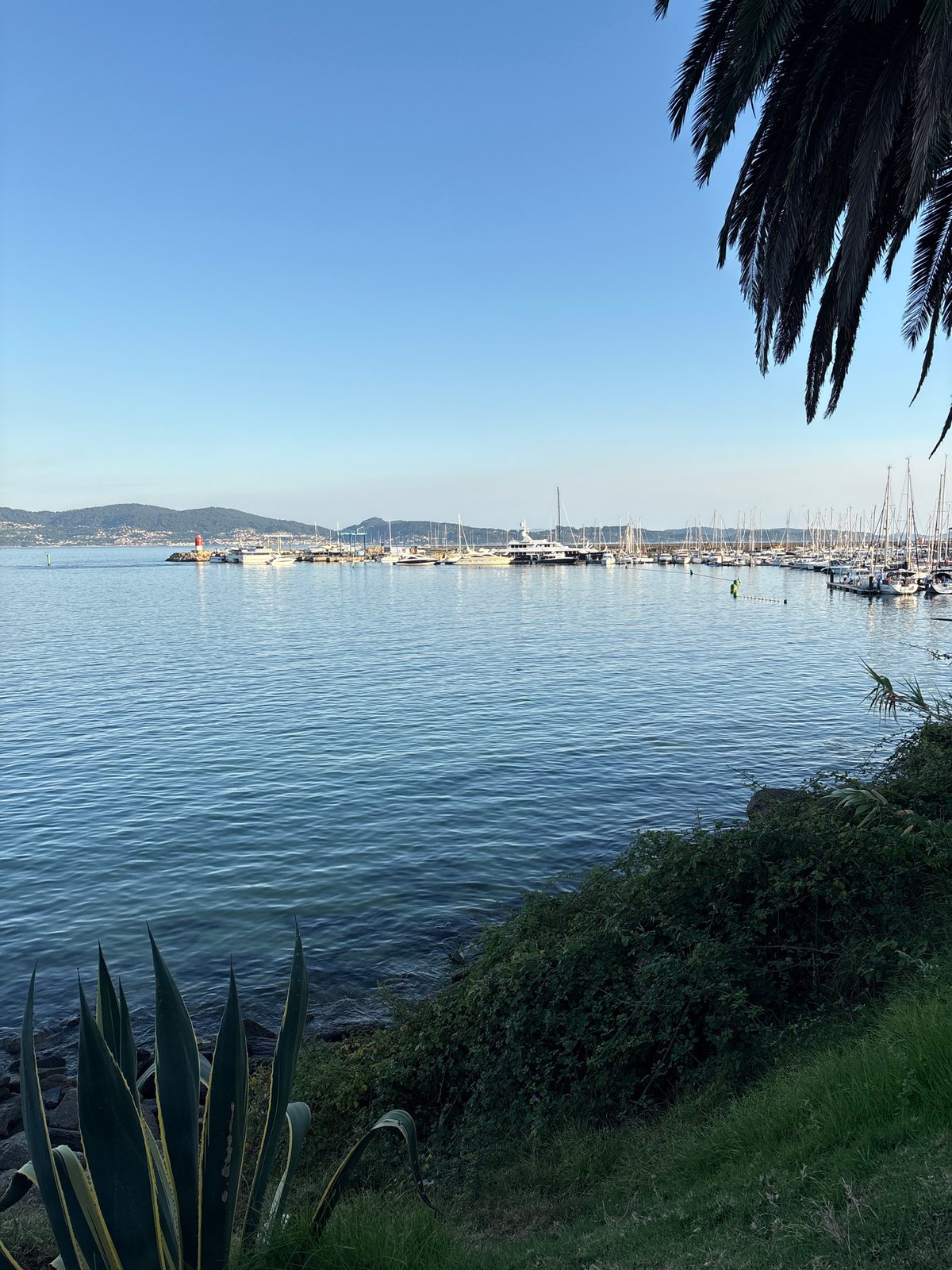 Marina views and a neighborhood playground in Sanxenxo, Spain