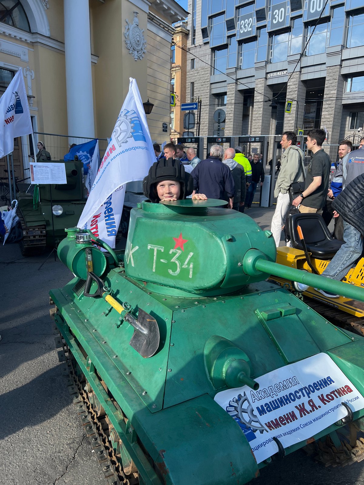 Children explore military vehicle display in Saint Petersburg