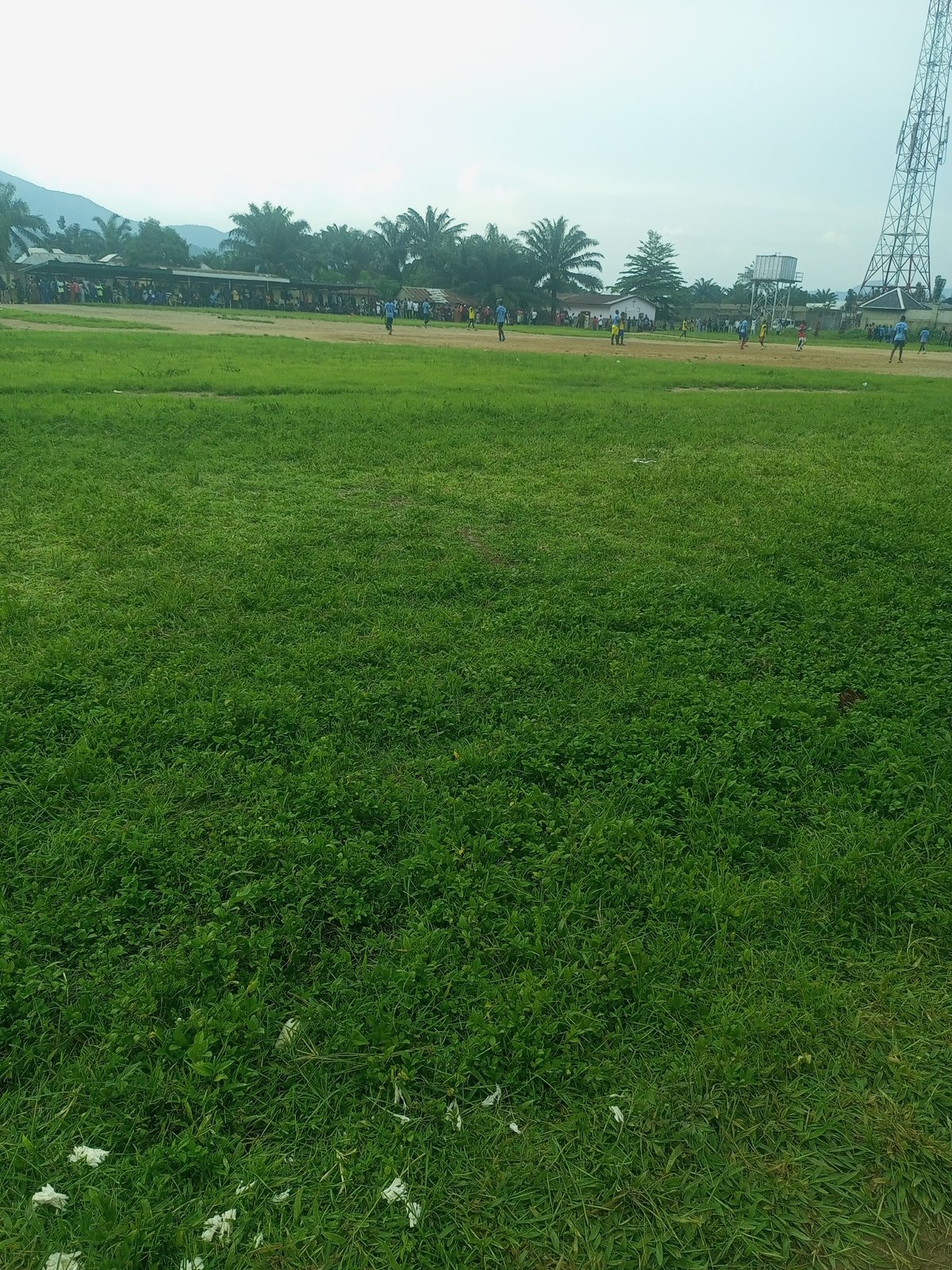 Afternoon soccer match on a grass field in Serti, Nigeria