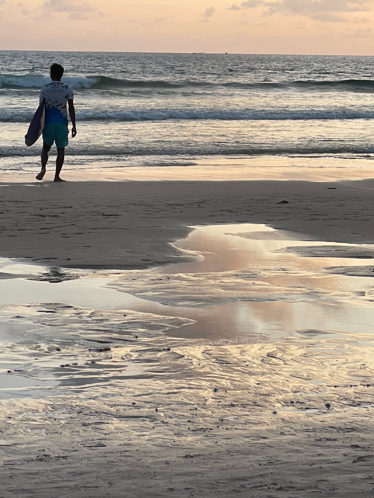 Rawai Beach at golden hour, surfboards and shoreline walks
