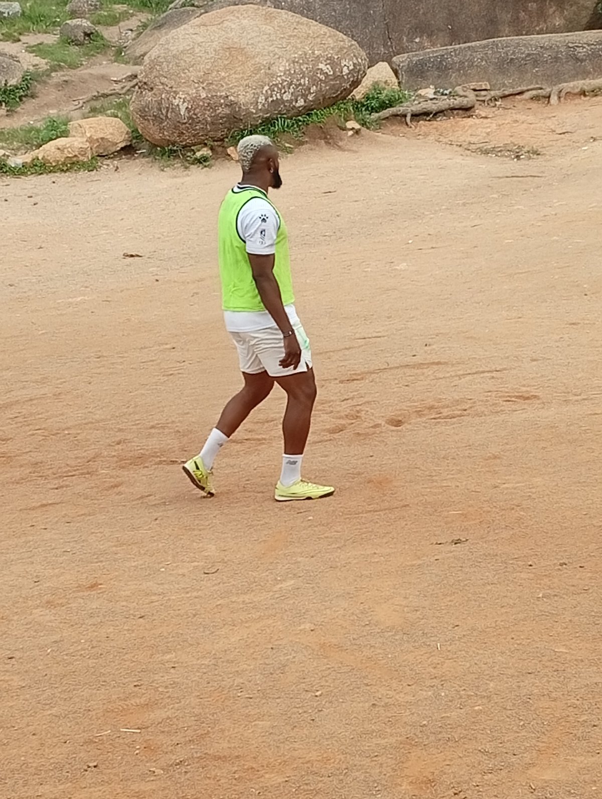 Football training session on a dusty Jos field, Nigeria.