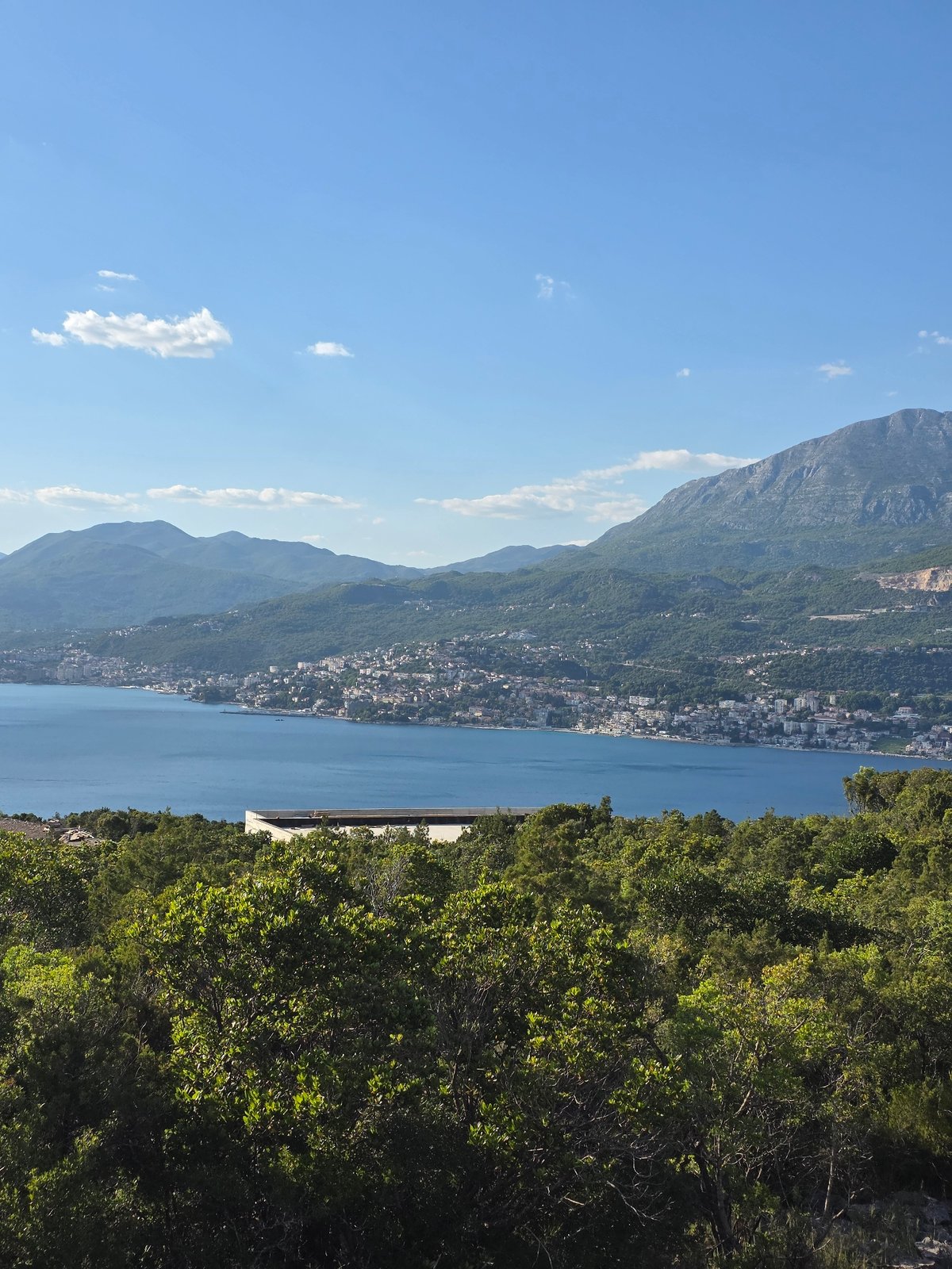 Tourist documents scenic Luštica coastline and historic stone churches