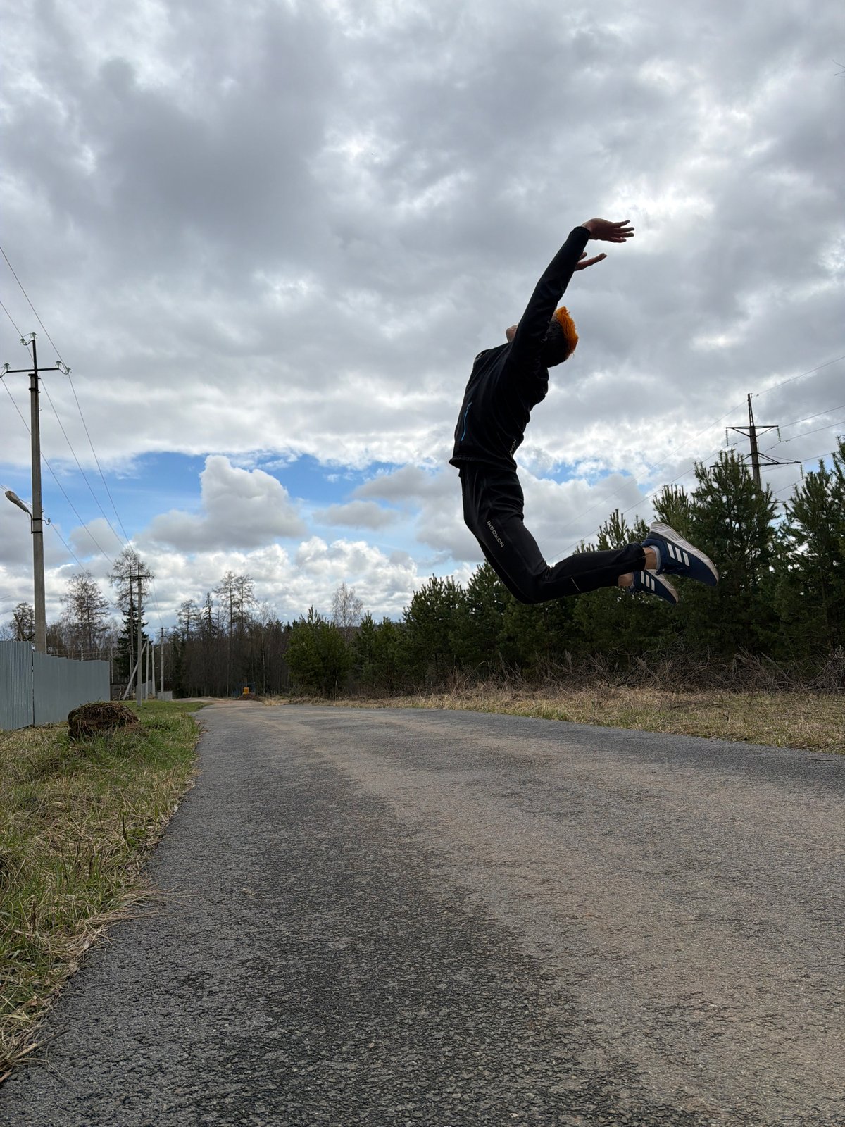 Orange-haired person performs acrobatic moves in Chaikovsky, Russia
