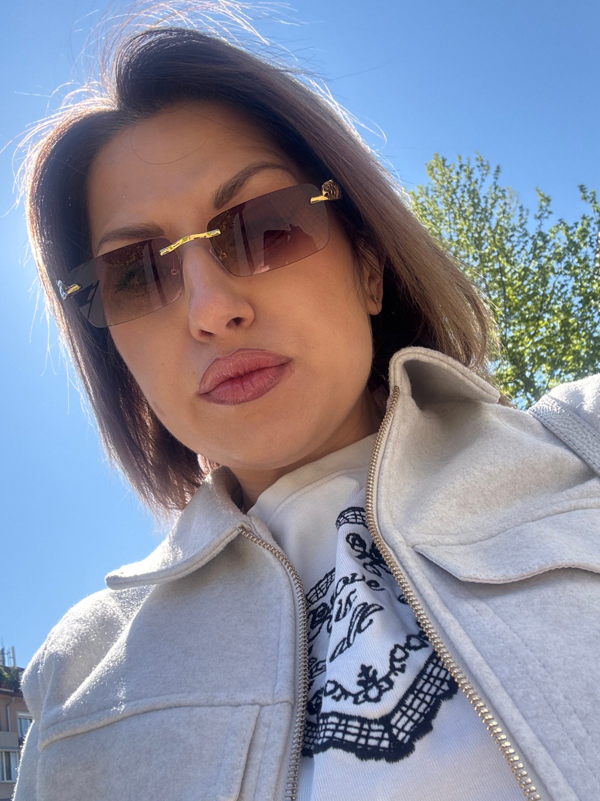 Woman takes morning selfies on Sofia street