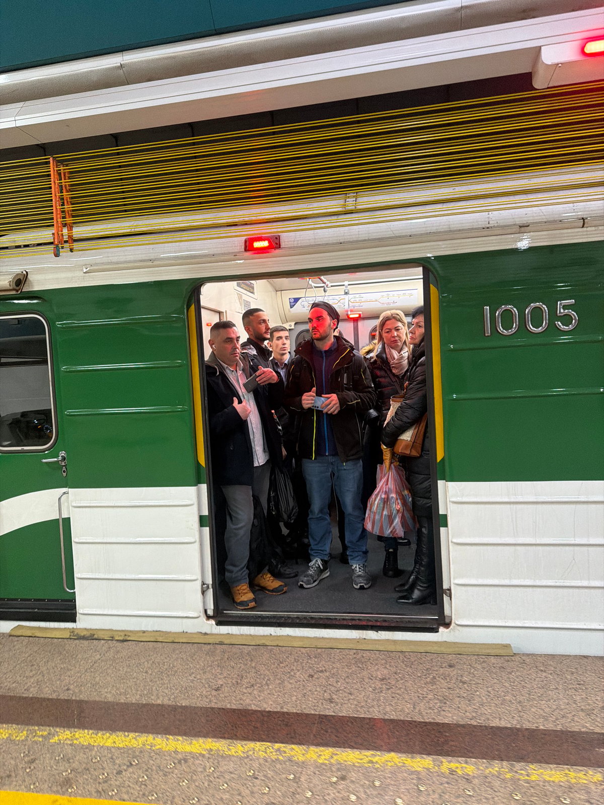 Packed subway car 1005 carries crowded passengers in Sofia