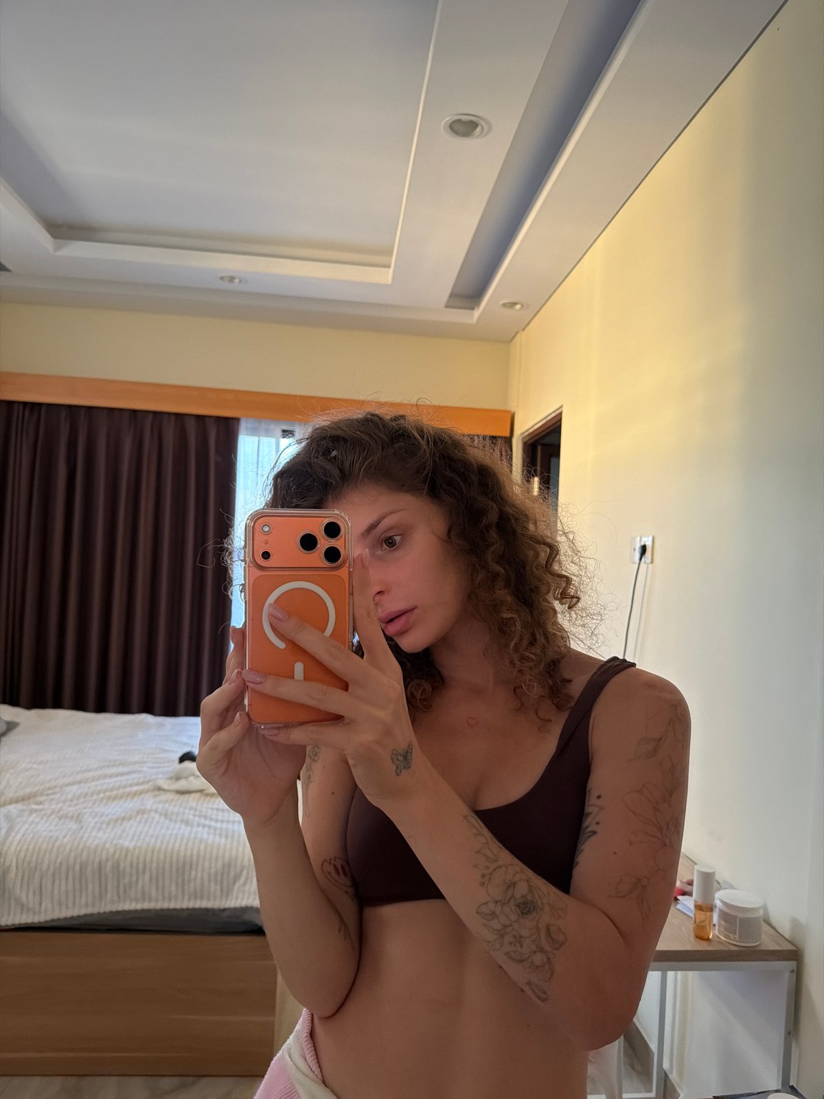 Woman takes selfies in North Kuta bedroom