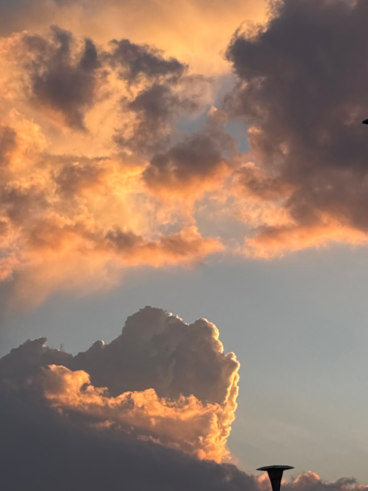 Metallic object spotted in cloudy sky over Mexico