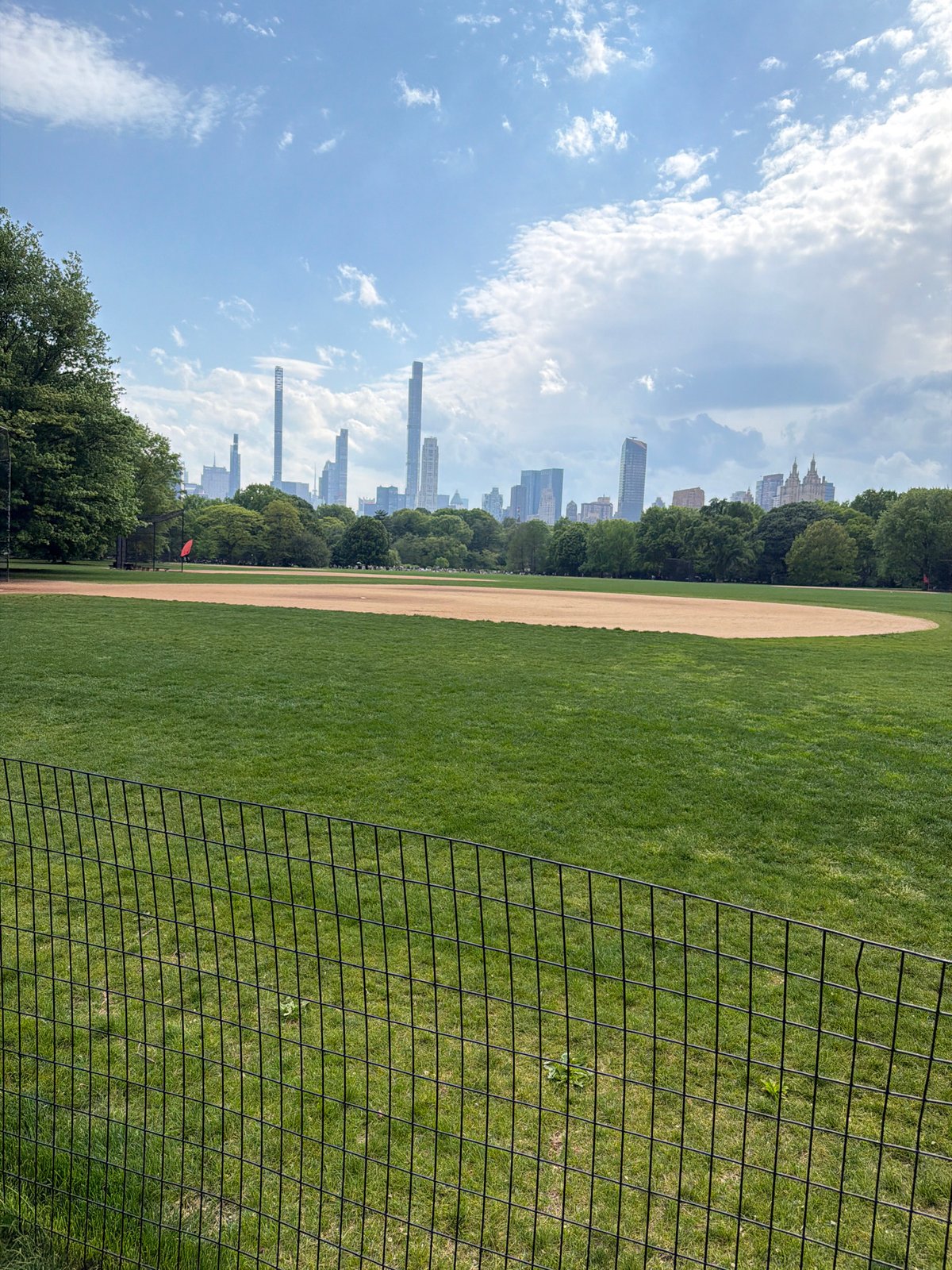 Baseball field observed in Central Park on spring evening