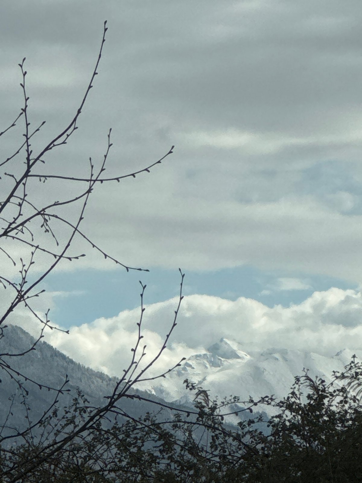 Mountain range viewed through clouds near Sirius, Russia