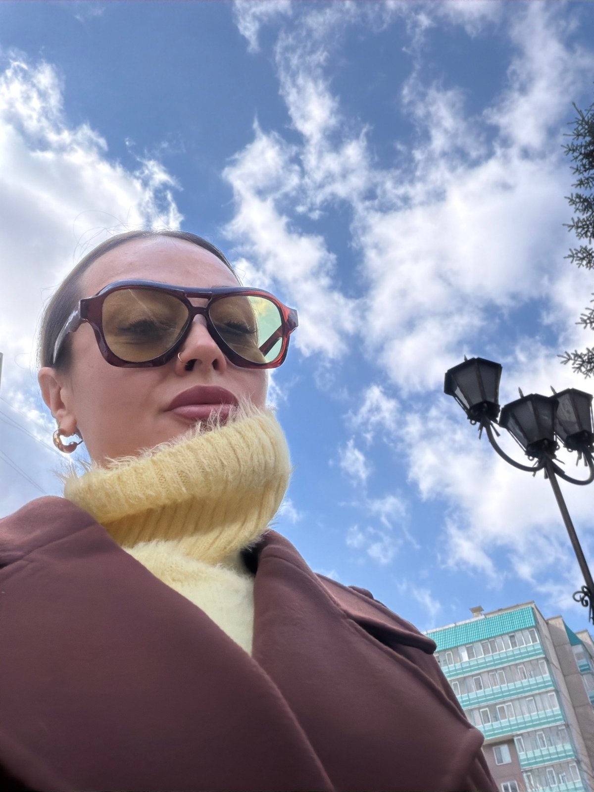 Person photographed looking skyward in Krasnoyarsk morning