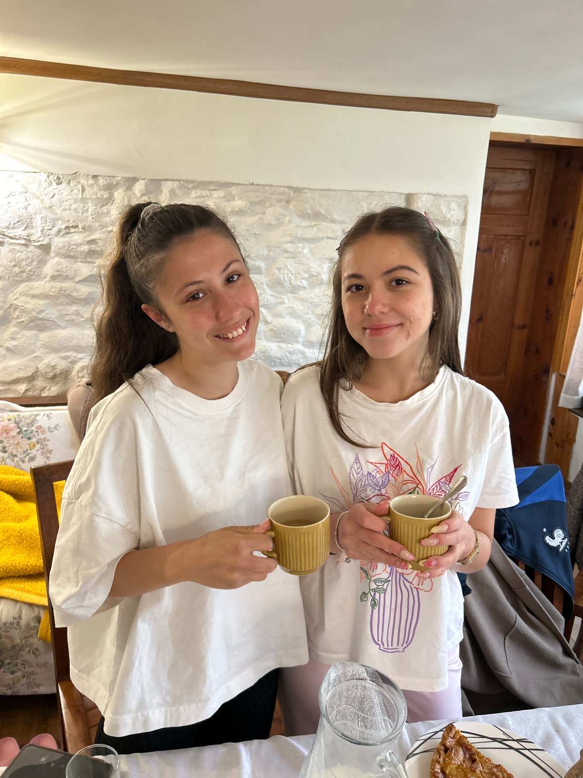 Two women share morning drinks in Apriltsi, Bulgaria