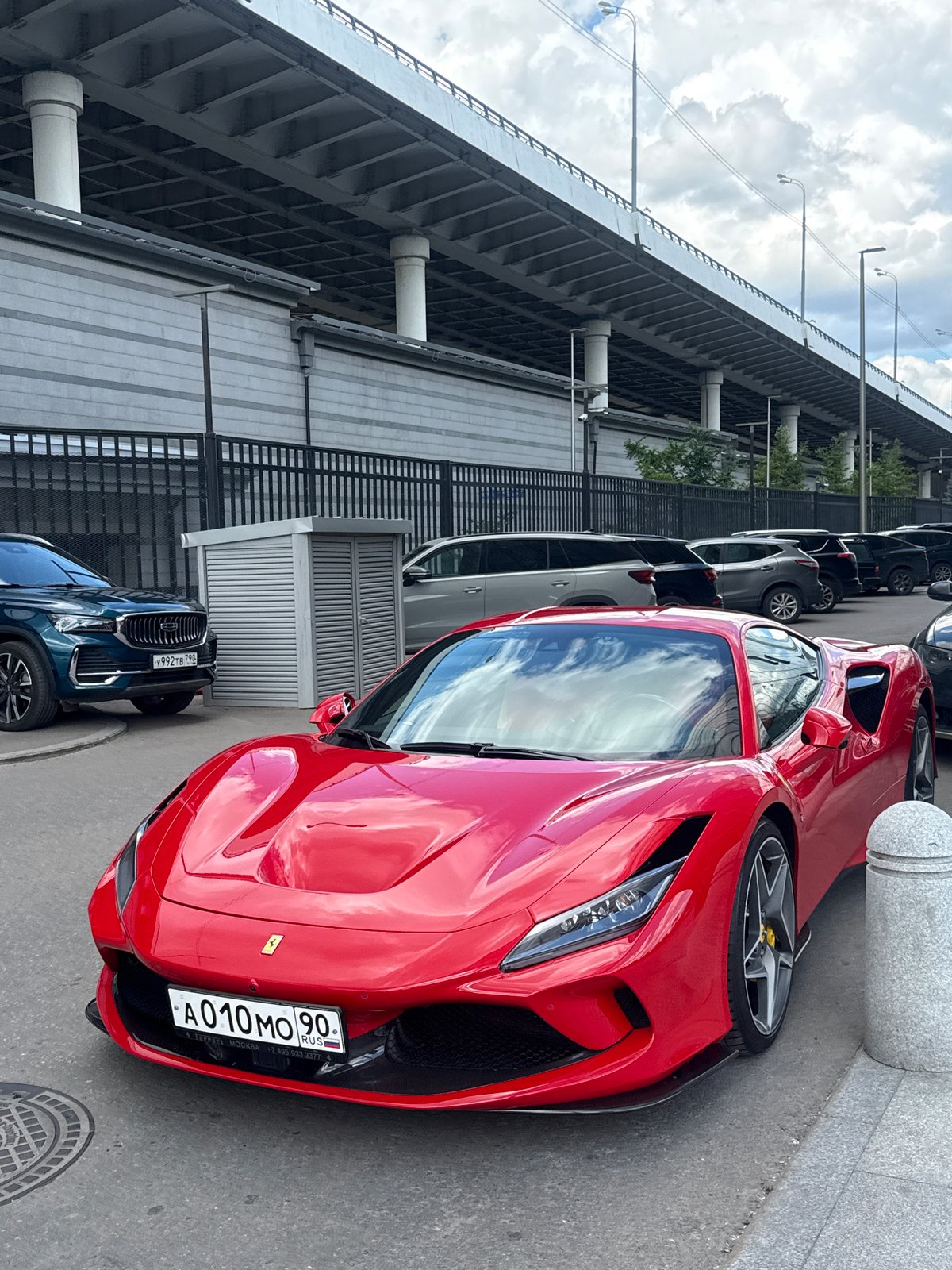 Red Ferrari F8 Tributo parked on a Moscow street