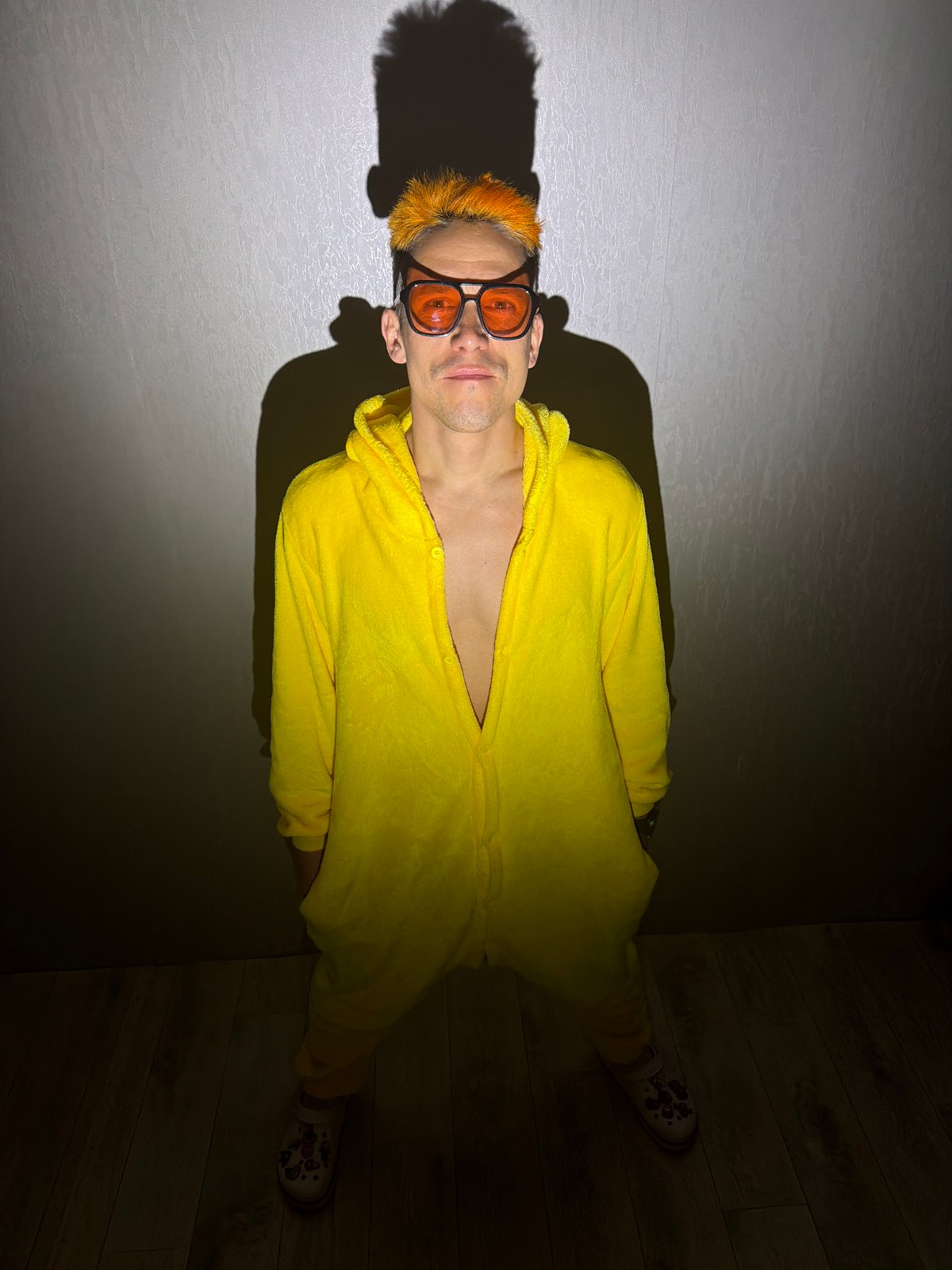 Person in yellow onesie photographed at Chaikovsky residence