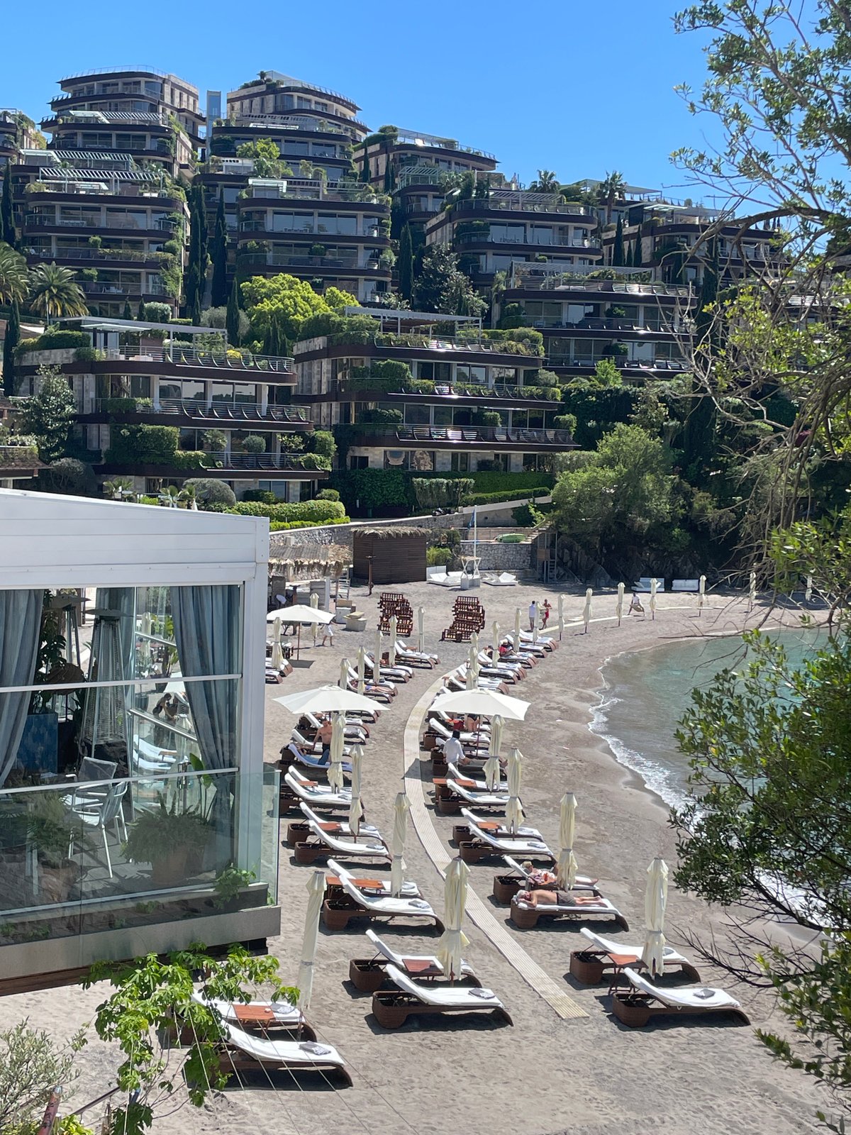 Tourists capture sunny beach scenes in Budva, Montenegro
