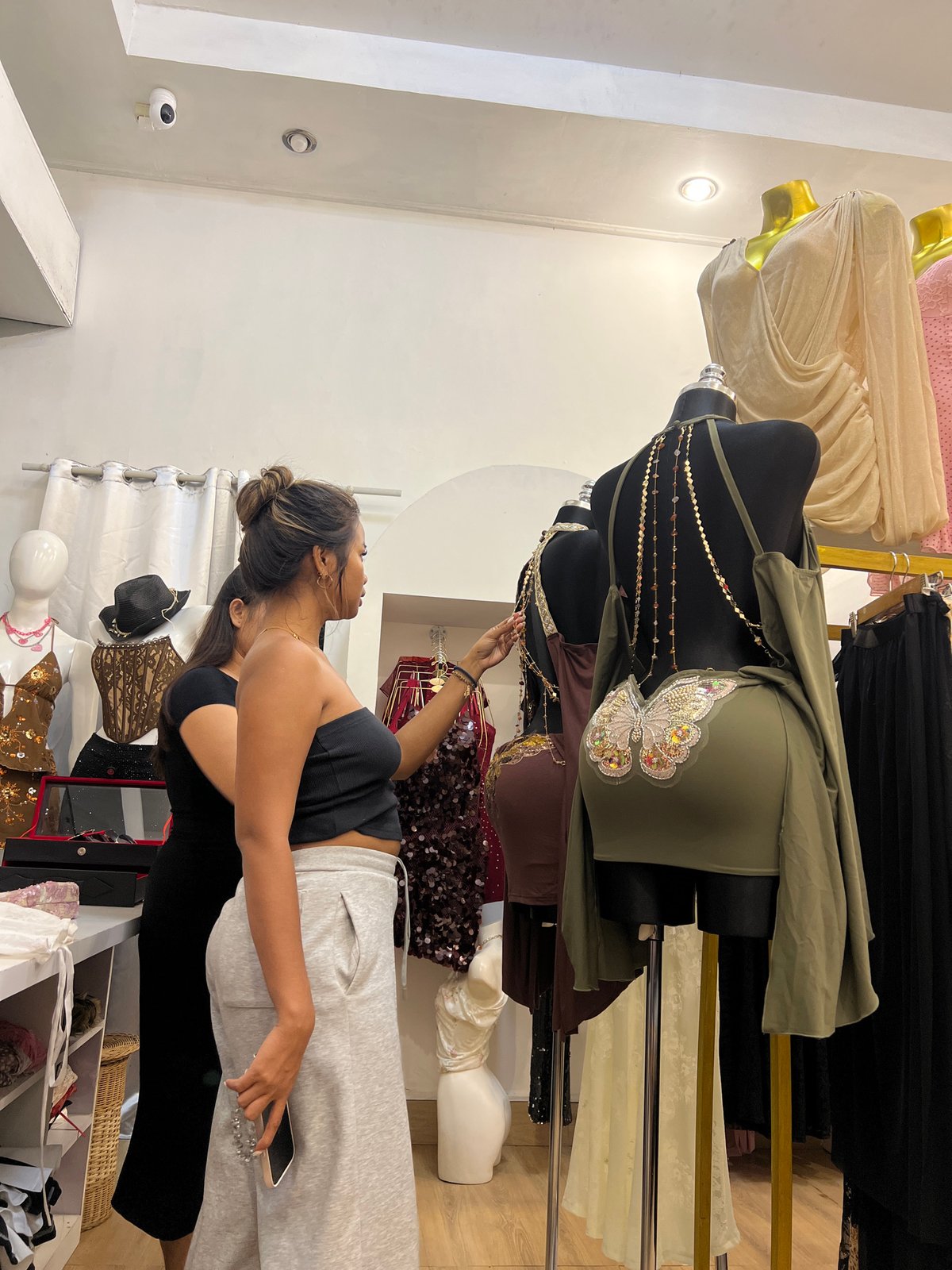 Woman shops for clothes at Kuta boutique