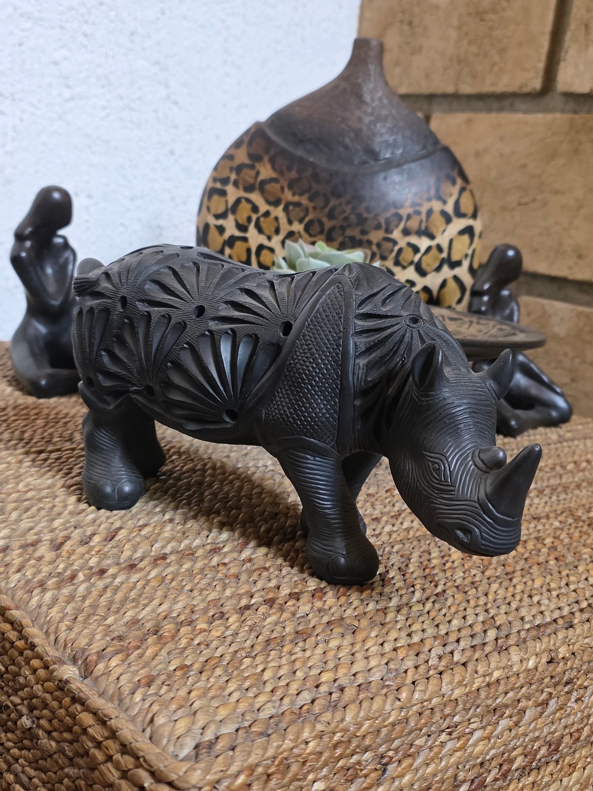 Carved wooden rhinoceros figurine observed in Cuernavaca, Mexico