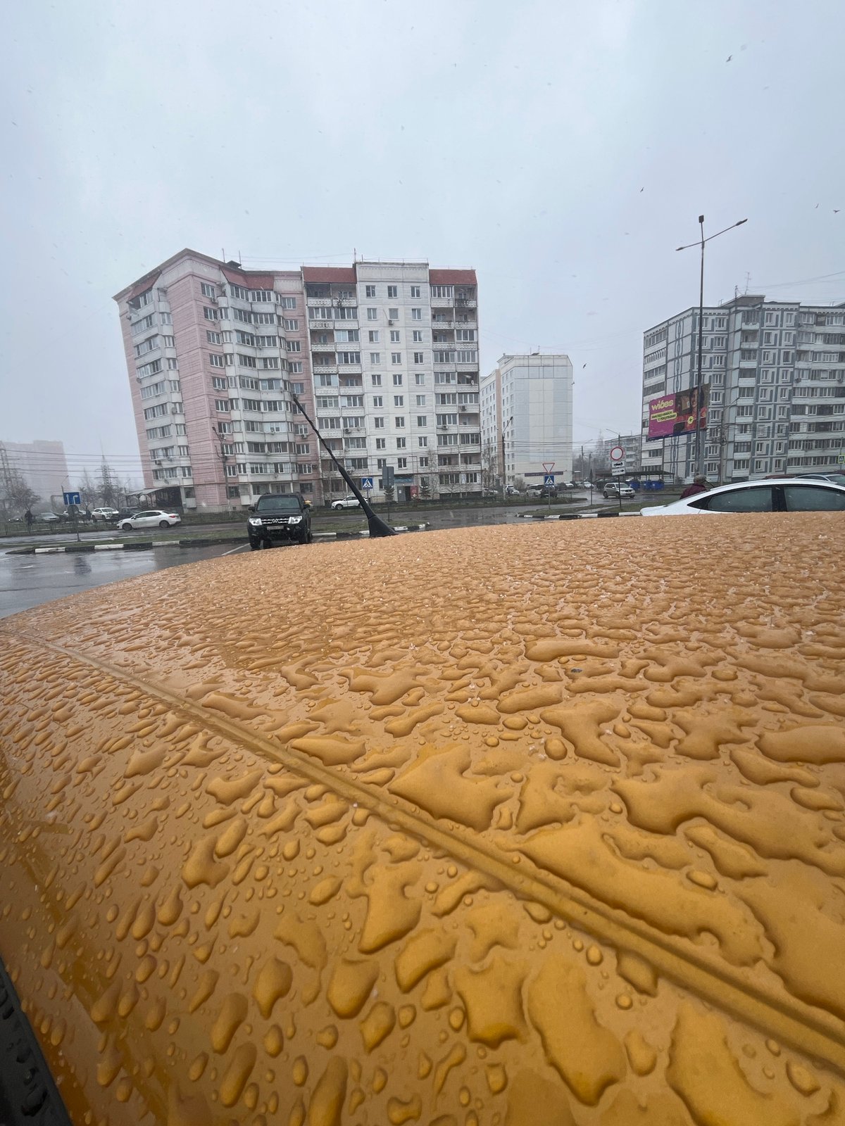 Rainy weather observed in Klin, Russia with tractor traffic