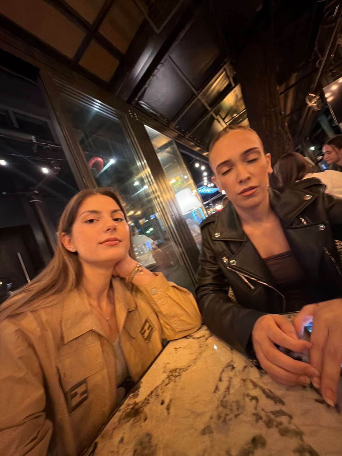 Two women share dinner and selfies at Sofia restaurant