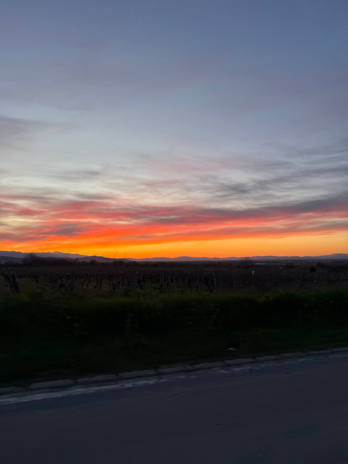 Sunset observed in Brestovitsa, Bulgaria displays orange-red light band