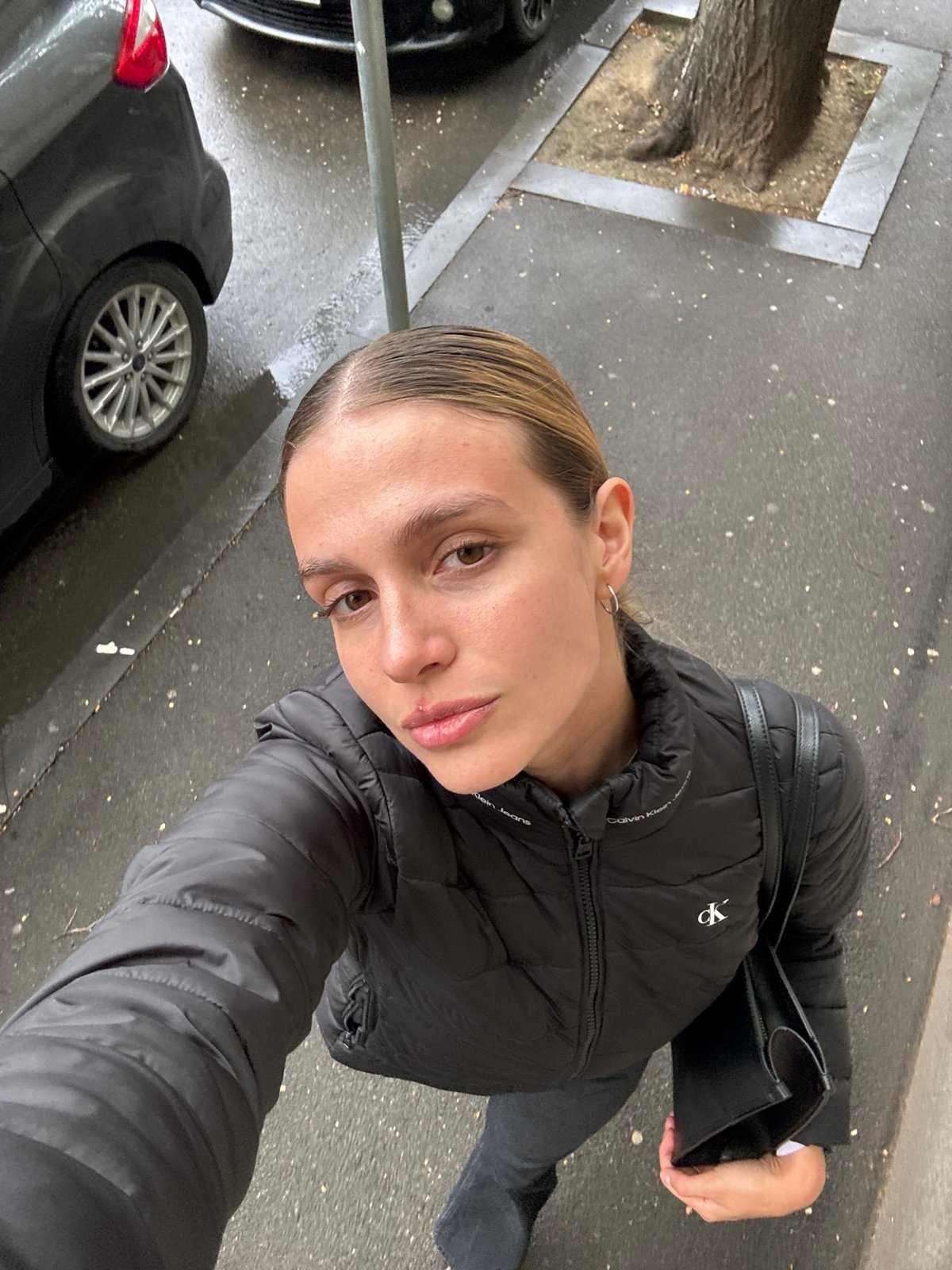 Woman takes cheerful selfies in downtown Tbilisi
