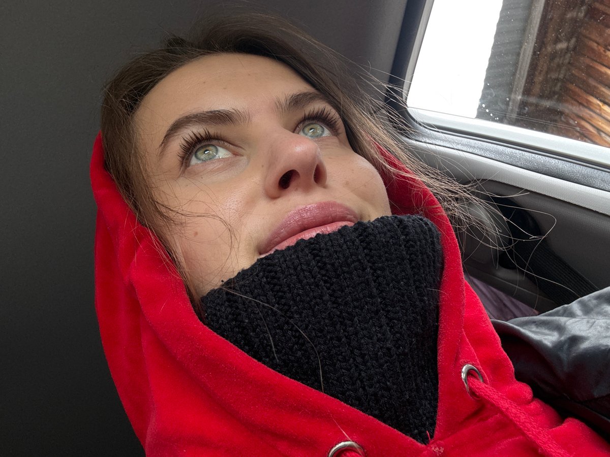 Morning moments captured in Прикамский: woman in car, cat behind frame
