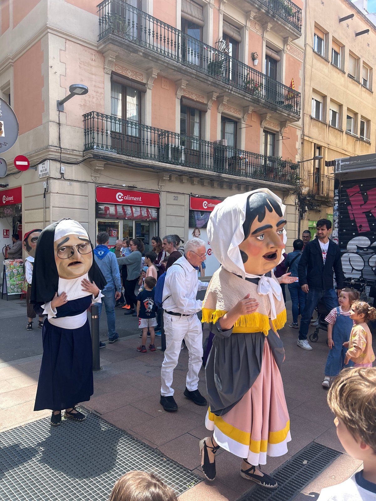 Traditional parade with giant figures marches through Barcelona streets