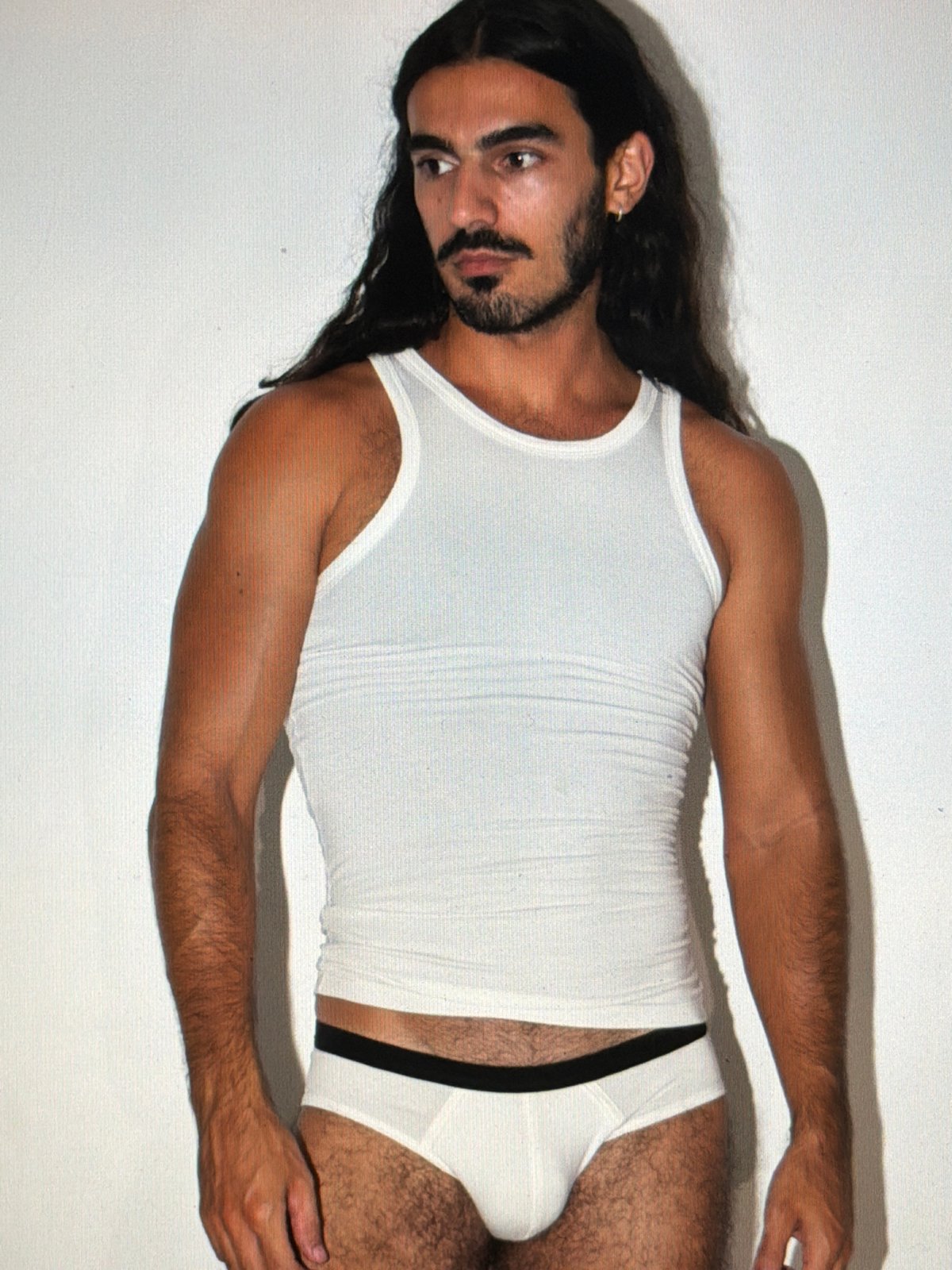 Man photographed on white backdrop in North Kuta