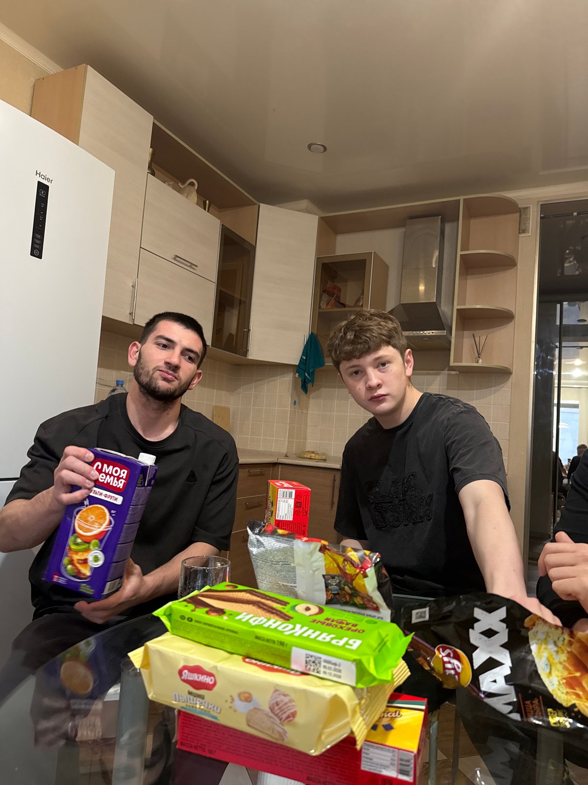 Friends gather for snacks in Kazan apartment