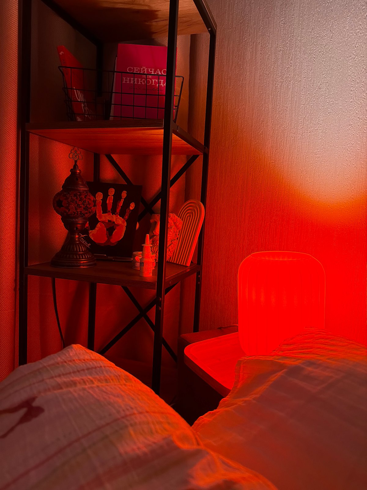 Moscow bedroom interior glowing under warm red lighting