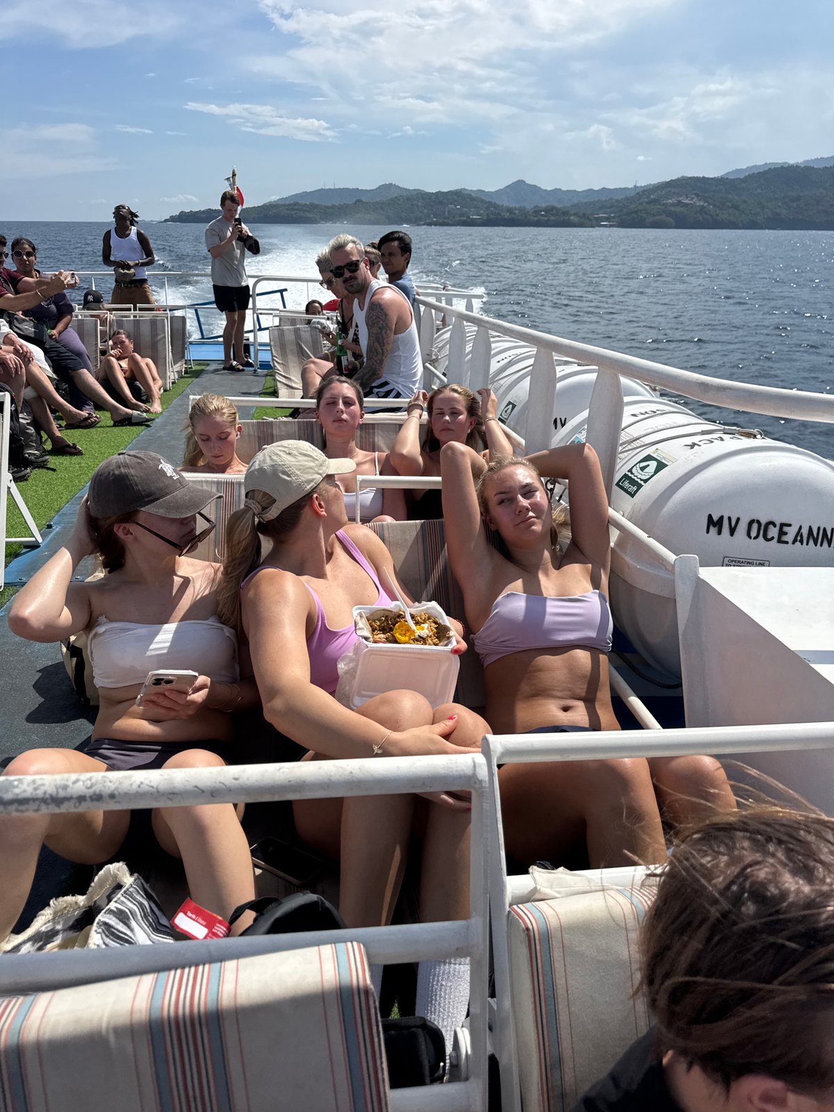 Ferry passengers travel across Indonesian waters during morning journey