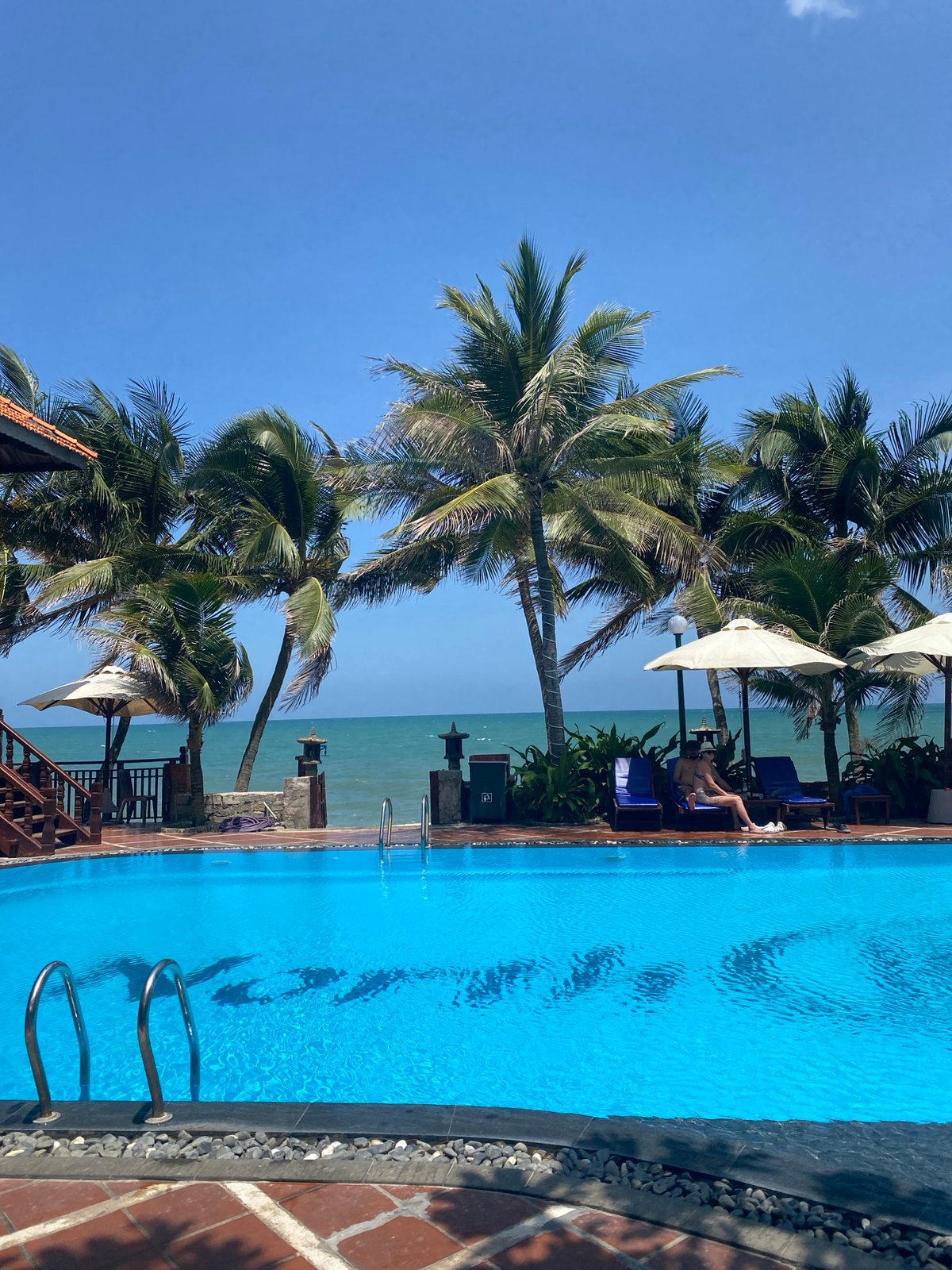 Woman documents morning leisure time at Vietnamese beach resort