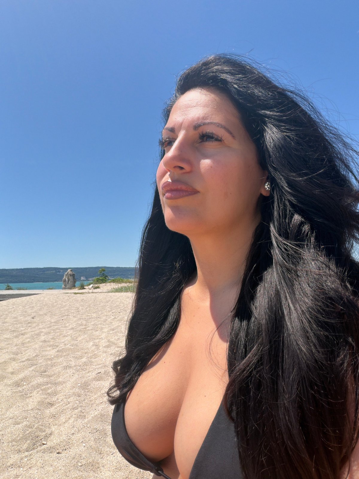 Woman photographed in profile on sunny day in Varna