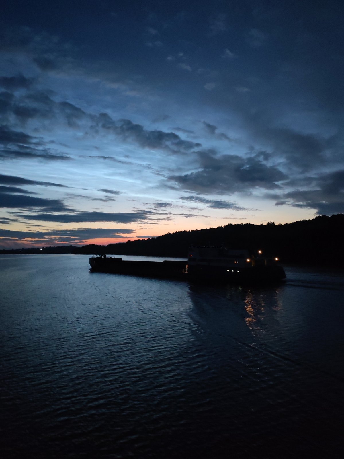 Barge on the river at dusk, Yakunina Gora