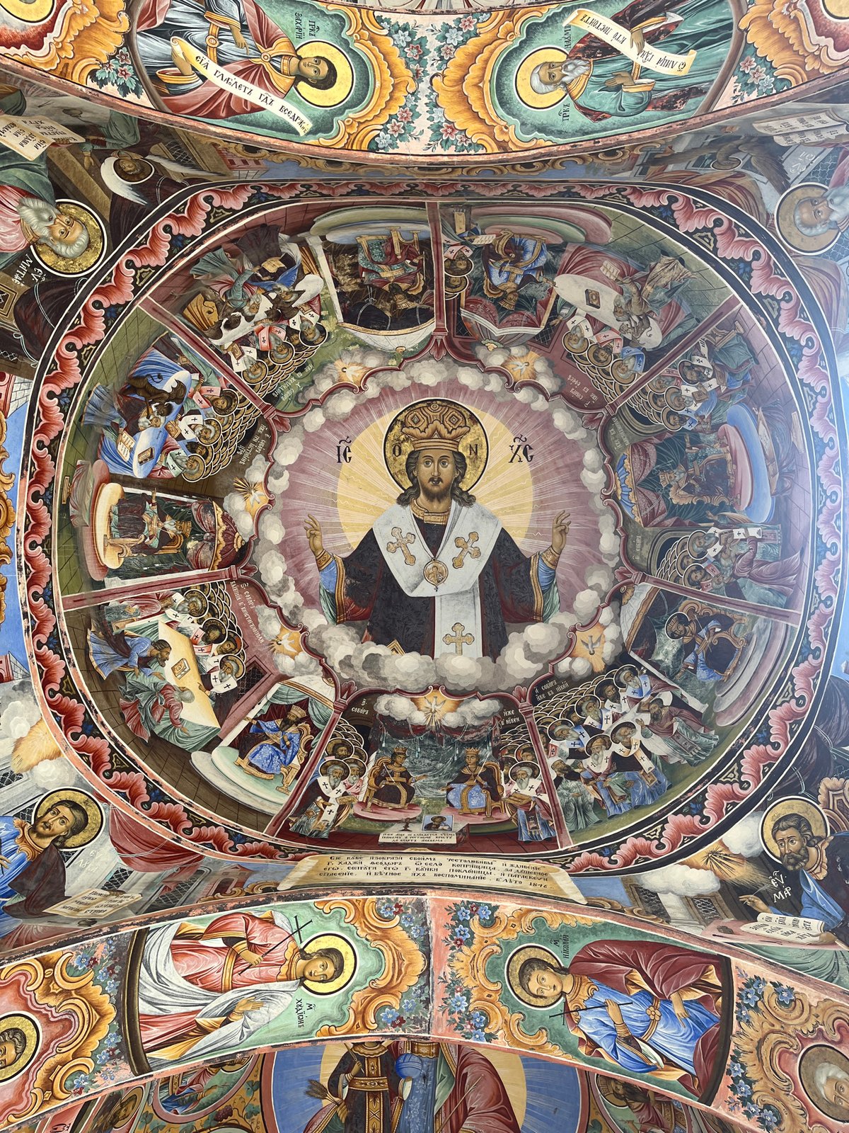 Visitor documents Rila Monastery's frescoes and distinctive architecture