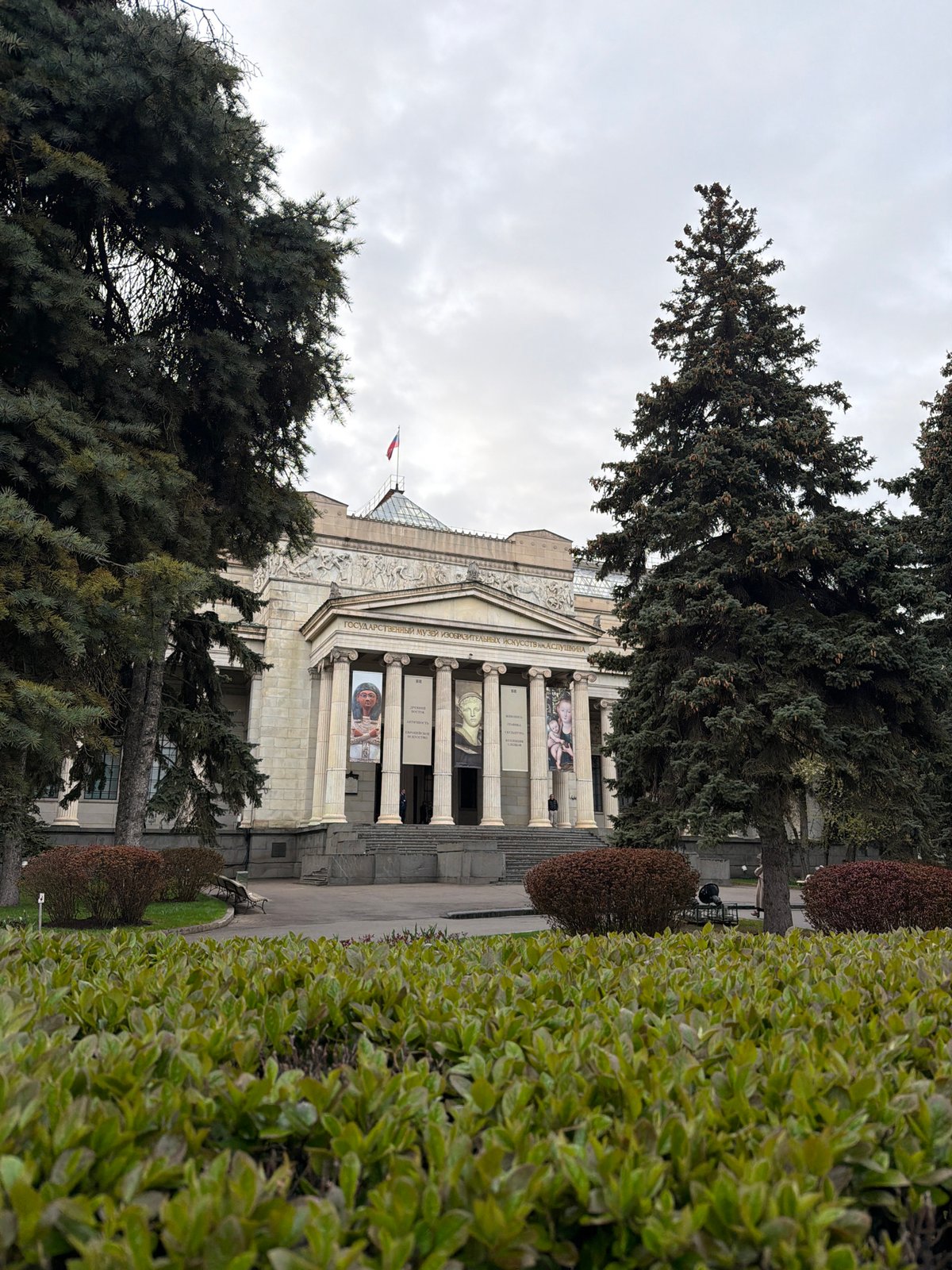 Visitor documents Pushkin Museum exterior and pavement markings in Moscow