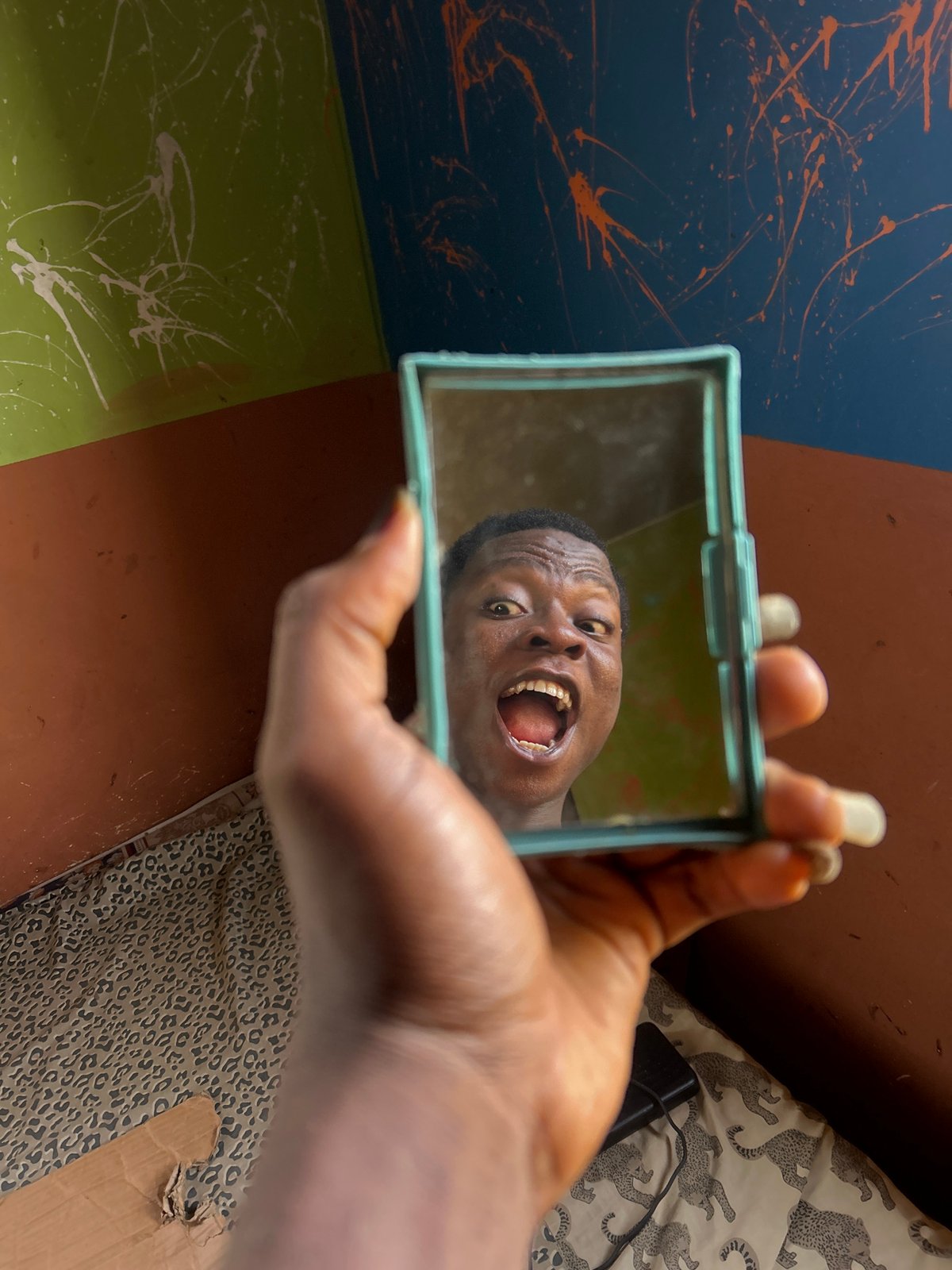 Person captured making expressive faces in playful photo session