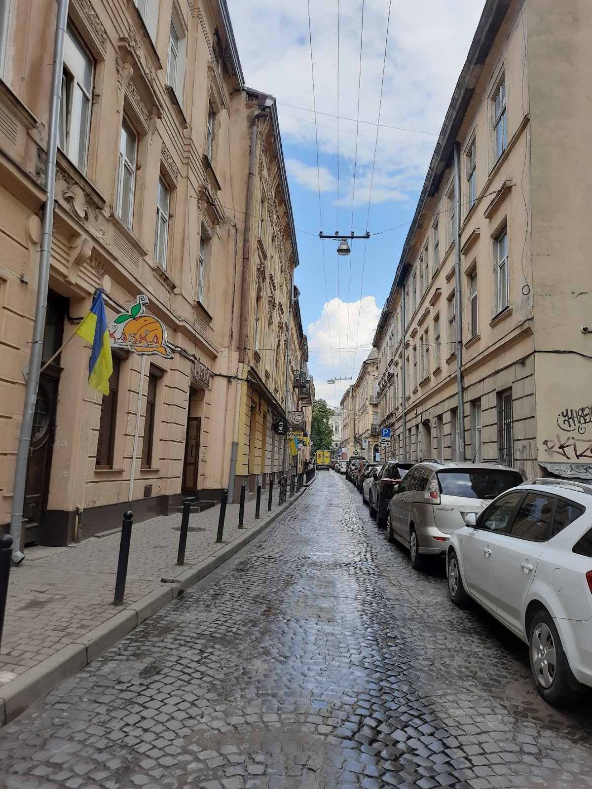 Rainy afternoon in Lviv's historic center, trams and old streets