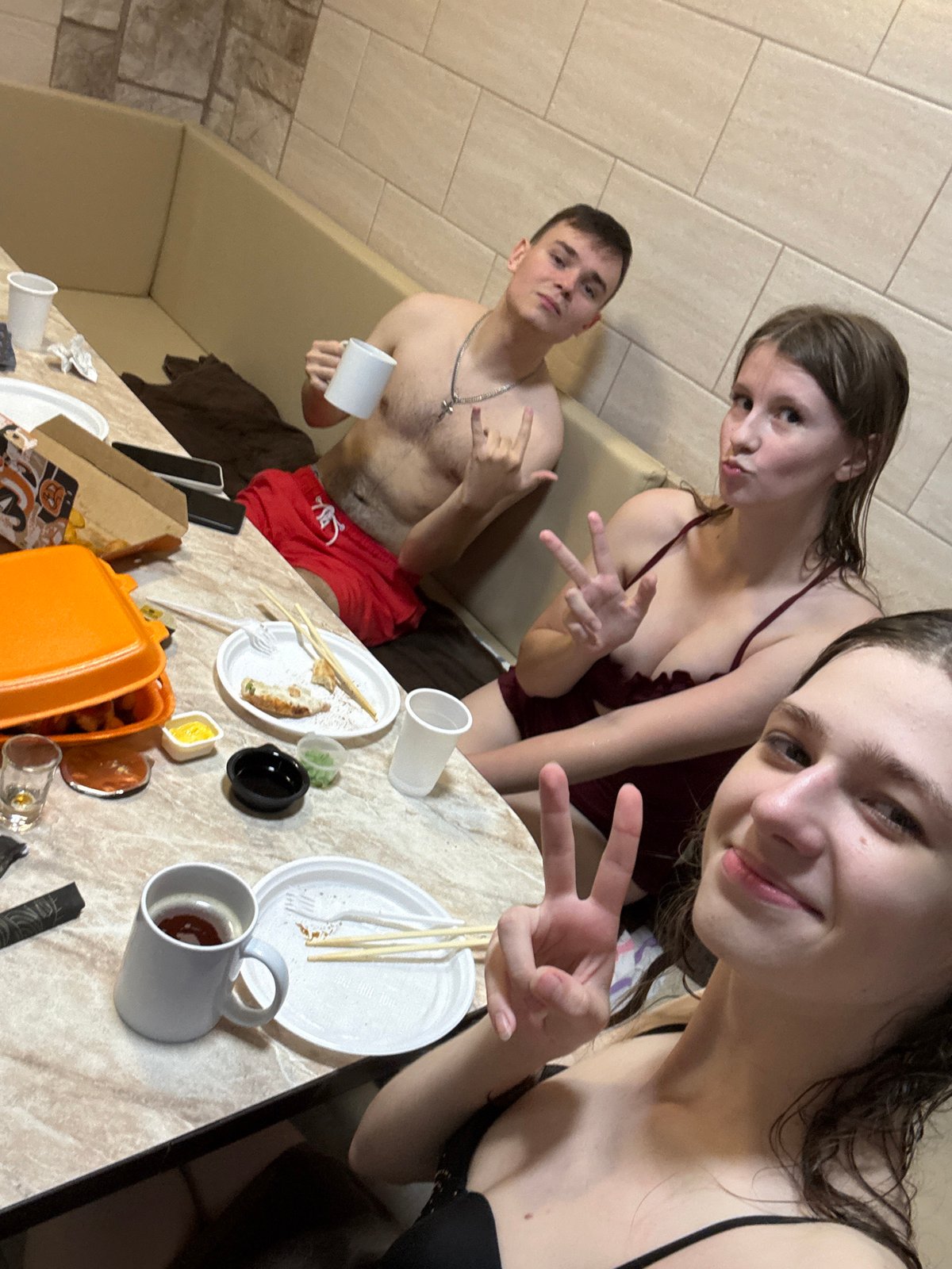 Casual gathering in a tiled indoor relaxation space, Birobidzhan